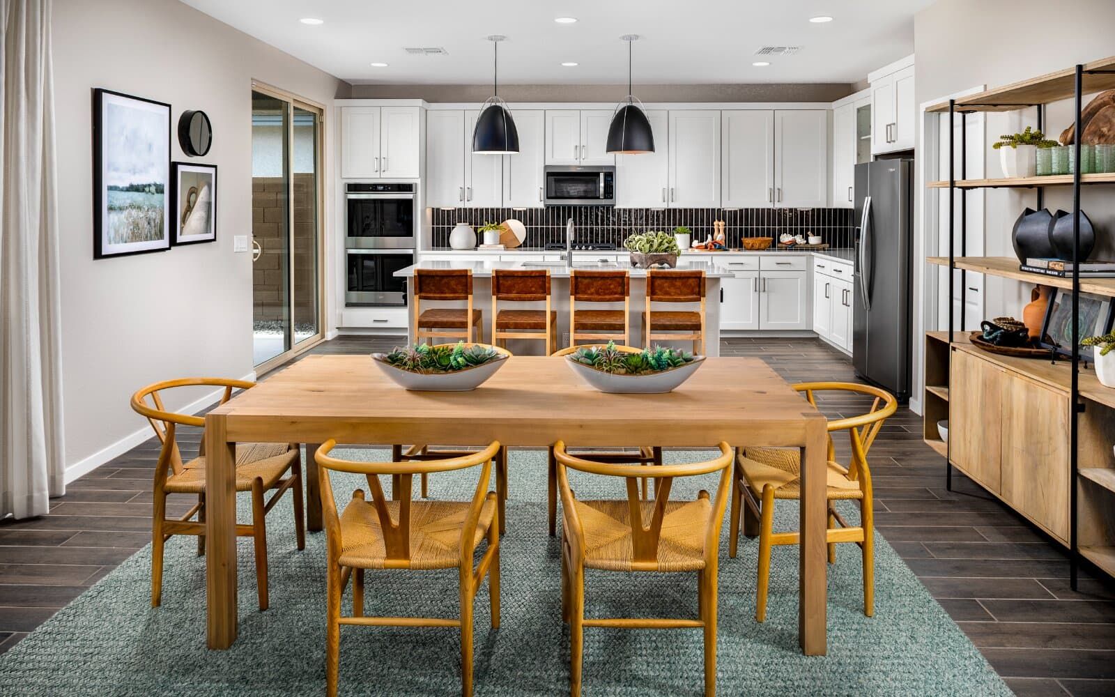 Dining and Kitchen:This image shows the dining and kitchen in the Ponderosa Model Home.