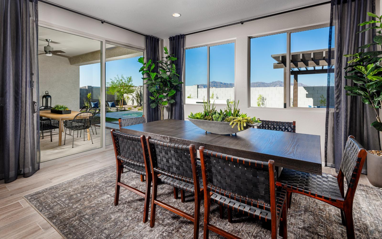 Dining:An image of the dining area in the Solstice model home at Mariposa in Blossom Rock.