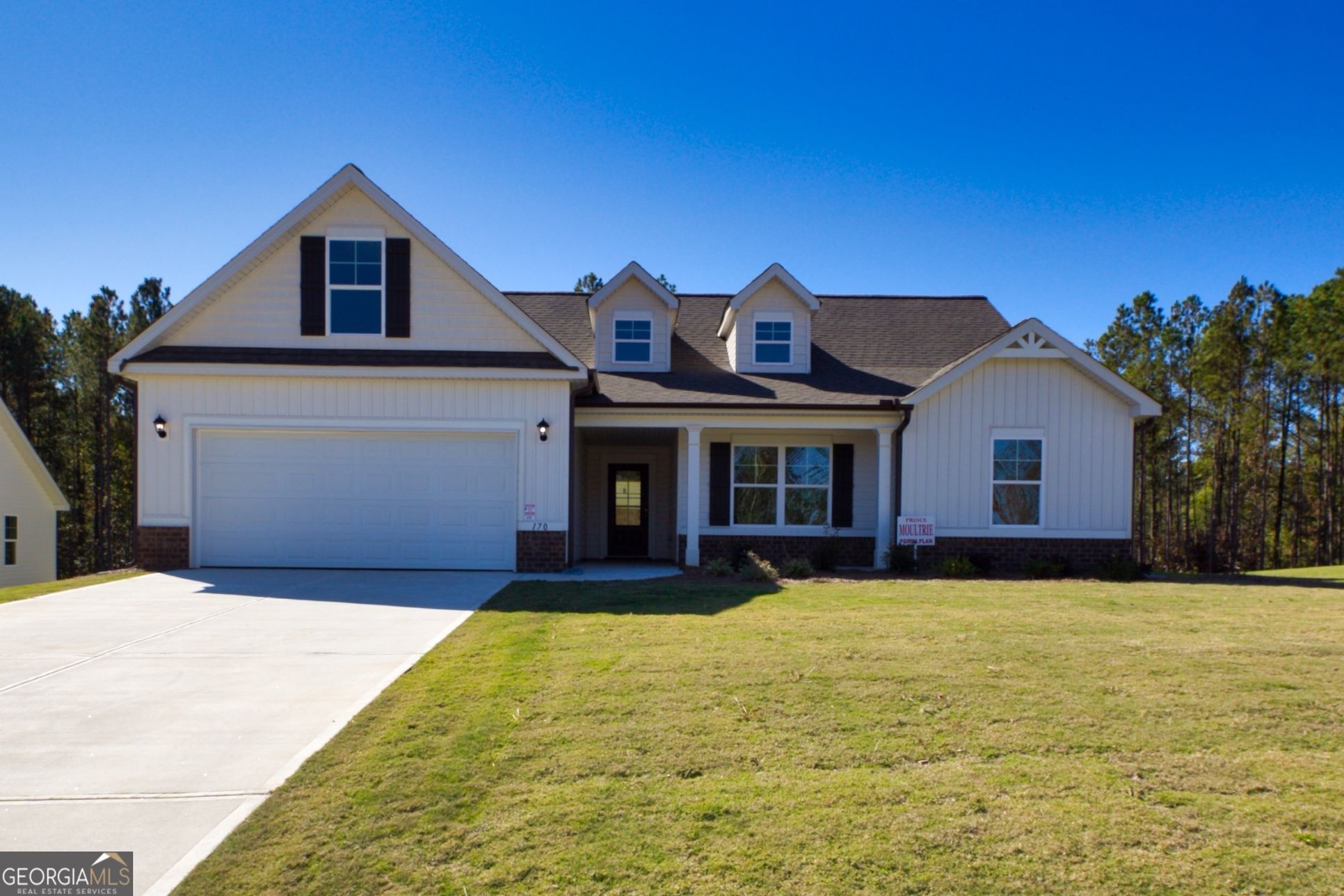 Savoy Par, 215 Eryn Terrace:Exterior View of Front of Property,  Double Car Garage, Two Coach Lights.  Brick Accents, Wanes Coat on Front.  Low Maintenance vinyl siding.  Aluminum Gutters, Sprinkler System