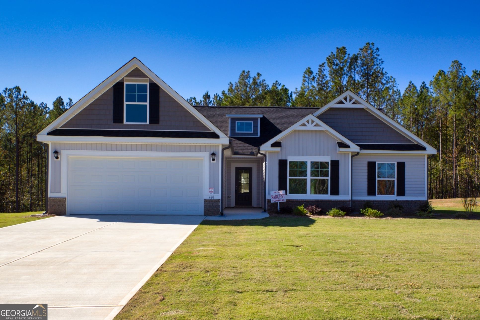 Savoy Park  105 Eryn Terrace:Front Exterior Entrance and Double Car Garage, Brick Accents, Wanes Coat on Exterior,  Low maintenance vinyl siding, One flood Light and Two Coach Lights, Aluminum gutters, sprinkler System,, Rocking Chair Front Porch