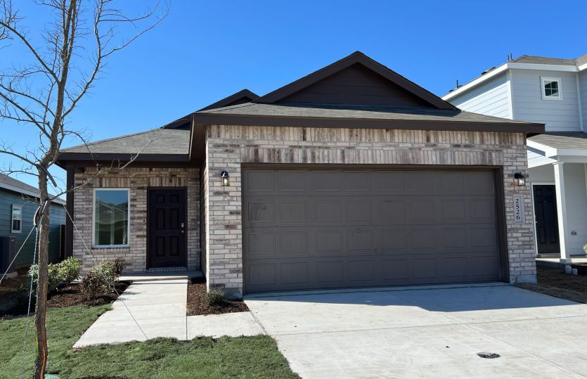 Exterior:The Livingston, a one-story home with 2-car garage, home exterior LS103 *exterior features may vary