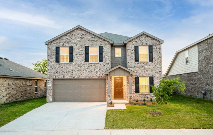Kisko:The Kisko, a two-story home with 2-car garage, shown with Home Exterior O