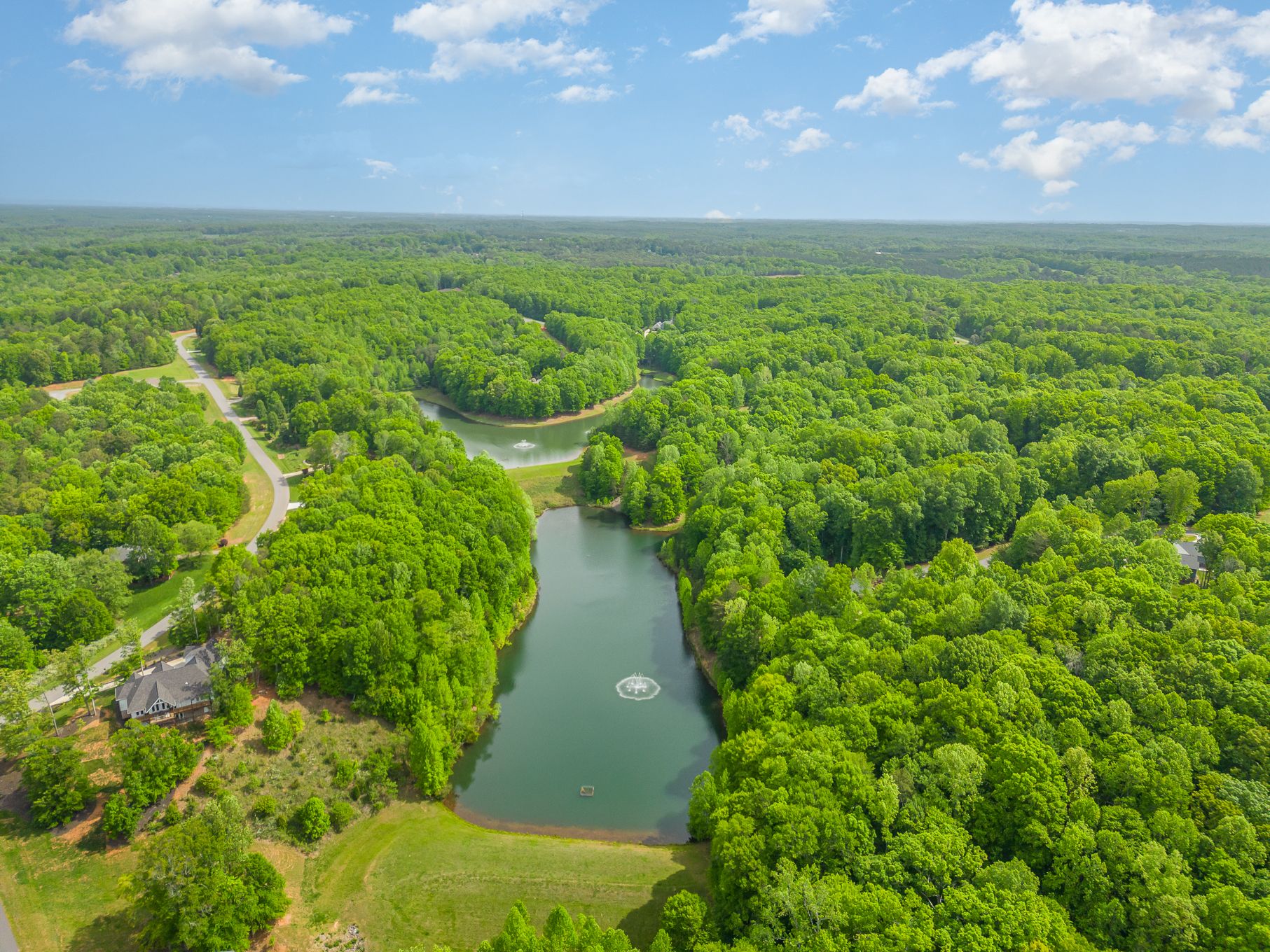 Two Stocked Ponds with Seating, Trails, and Water Fountains are Picturesque Neighborhood Features:Harbor Watch has two ponds free for neighbors to fish in (catch and release only, please). 