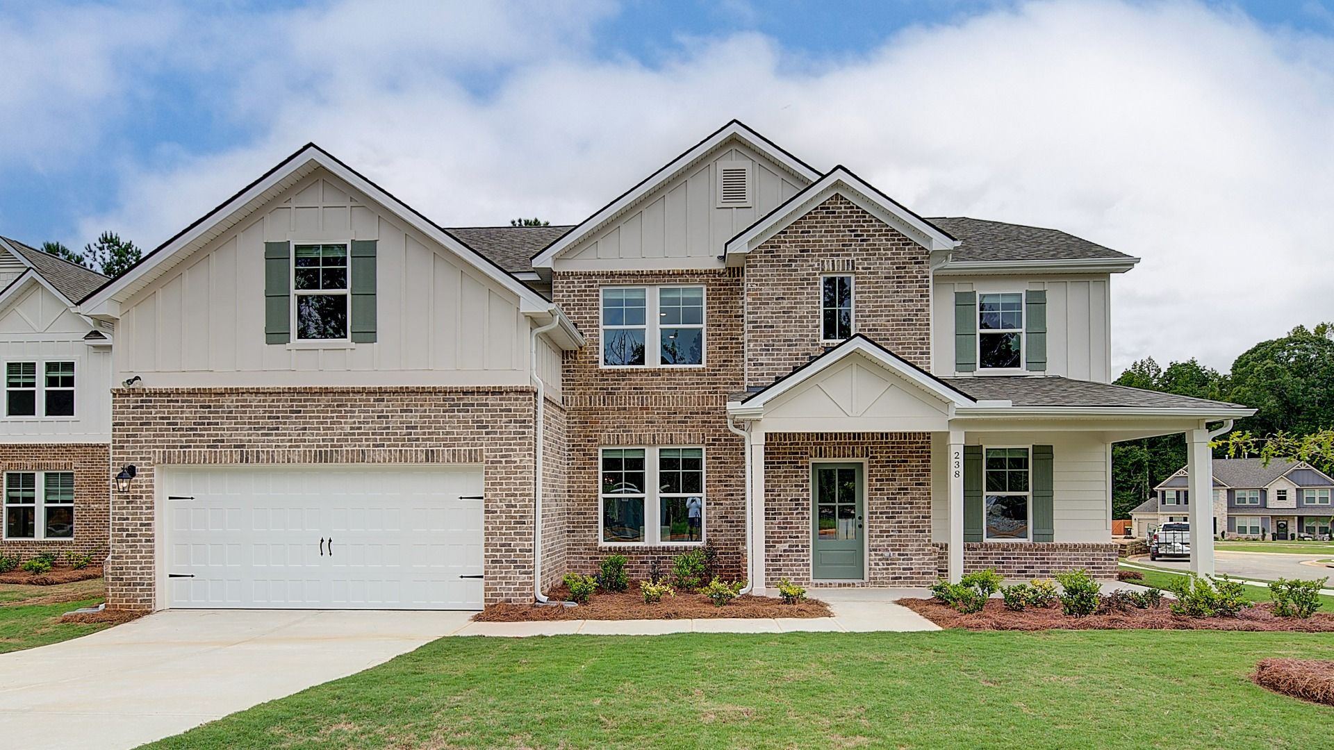 Elevation 2:Meridian II two-story new construction estate-sized home with two-car front-entry garage at Brighton in Locust Grove, GA.