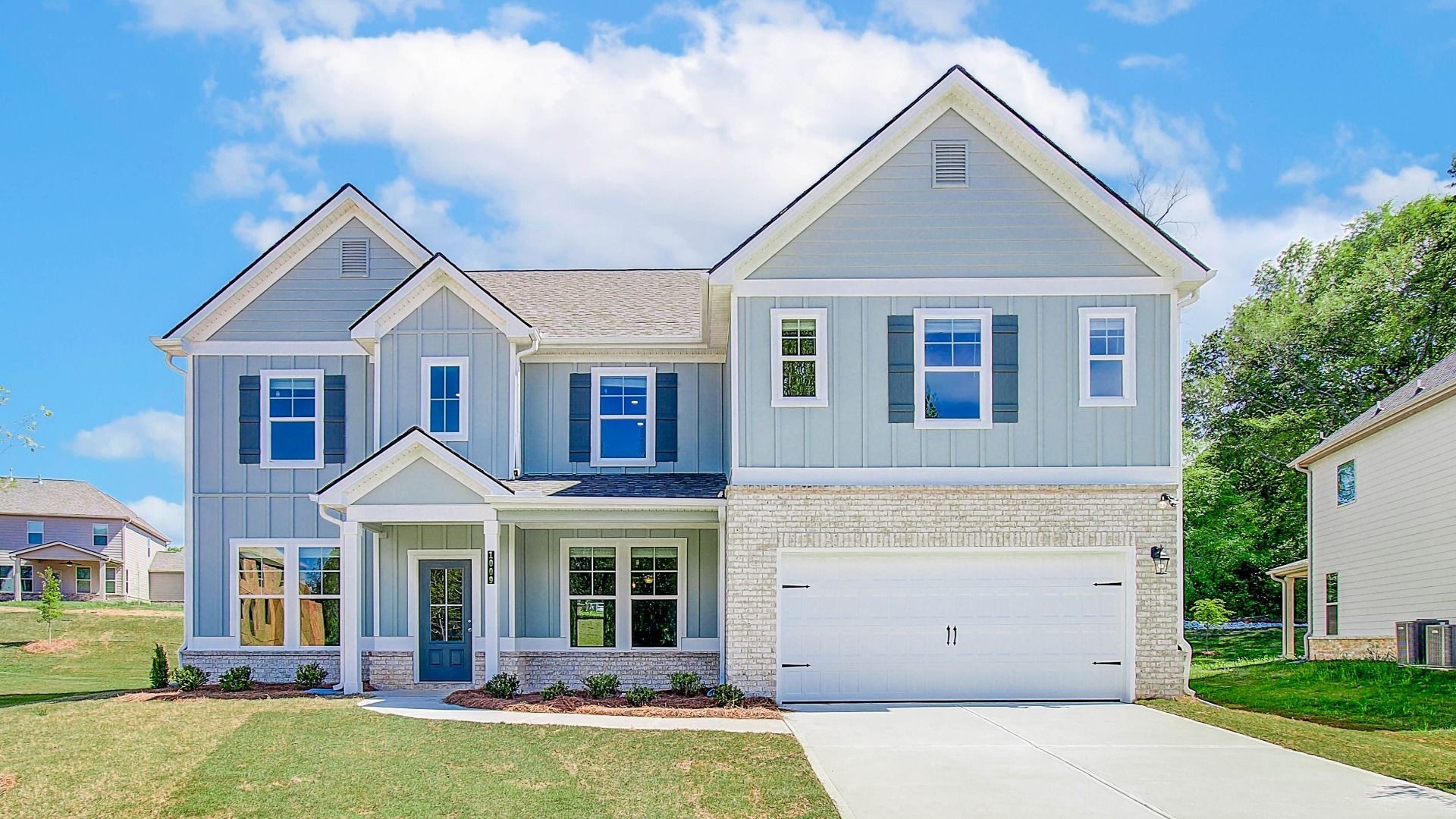 Elevation 2:McKinley II two-story home with brick accent exterior and two-car front-entry garage at Brighton in Locust Grove, GA.