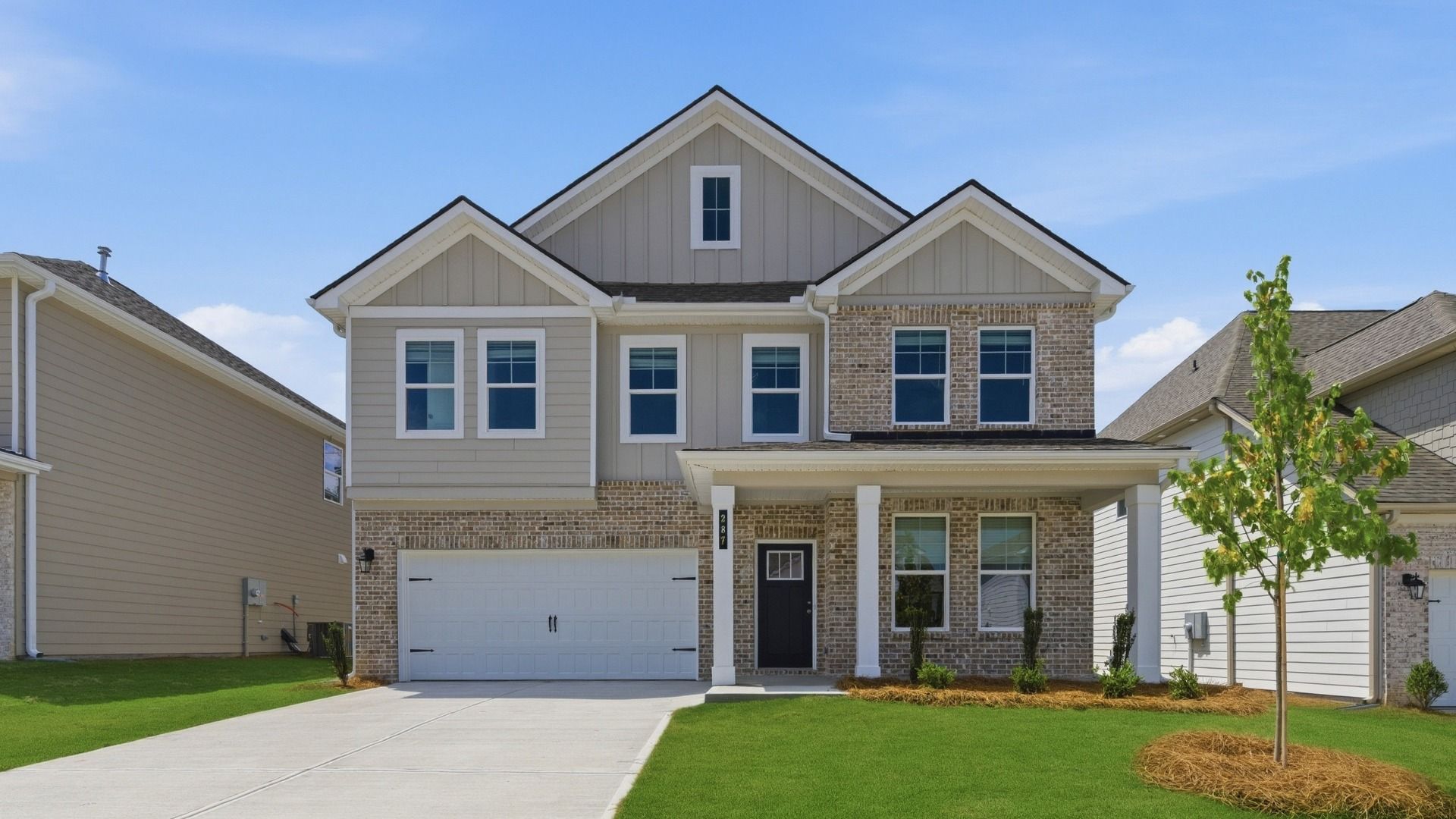 Elevation 7:Wagener brick and siding exterior in Abbotts Crossing showing two-story home and two-car front-entry garage.