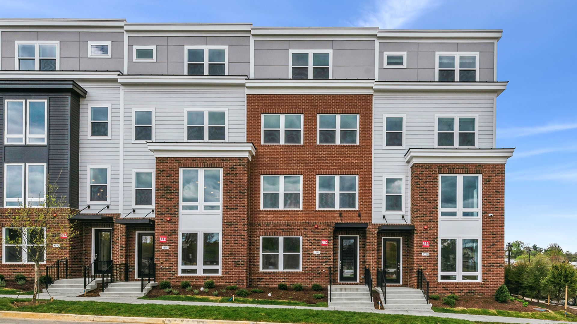 Exterior Front - Elevation 3:Cary Townhome Exterior at Northfax West - Featuring 4-Levels of Living Space and a 2-Car Rear Garage