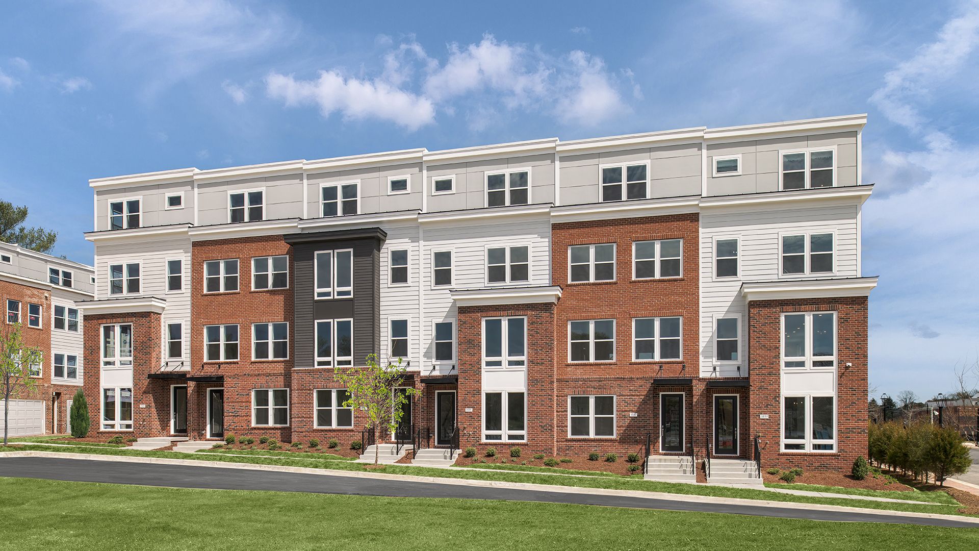 Cary Townhome Exterior:Cary Townhome Exterior at Northfax West - Featuring 4-Levels of Living Space and a 2-Car Rear Garage