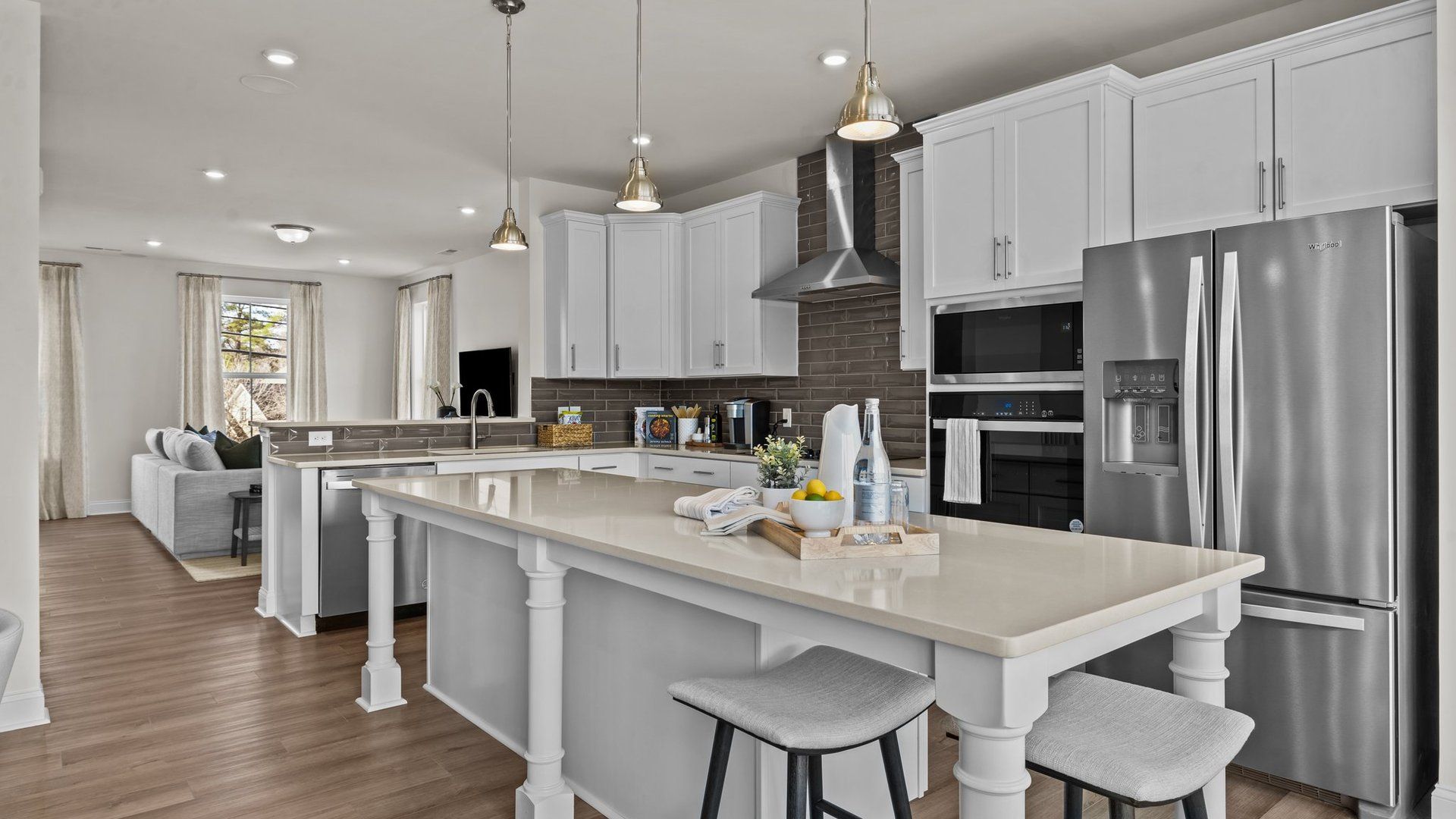 Gourmet kitchen with wall oven/microwave, vented hood, and extended island, by DRB Homes Charlotte:Gourmet kitchen with wall oven/microwave, vented hood, and extended island, by DRB Homes Charlotte, NC