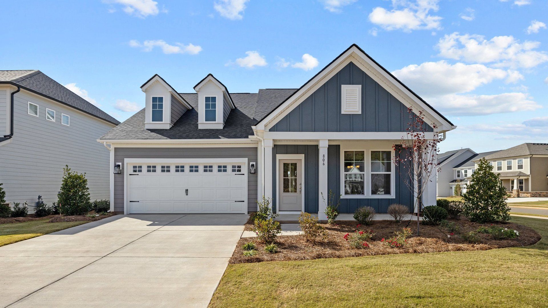 Fairfield design front elevation with covered front porch at Lakeside Glen by DRB Homes, York, SC.:Fairfield design front elevation with rocking chair covered front porch at Lakeside Glen by DRB Homes, York, SC.