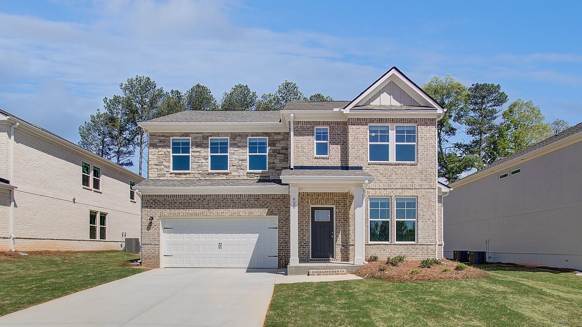 Elevation 5:Ridgewood two-story home with brick exterior and two-car front-entry garage at Bowers Farm in McDonough, GA.