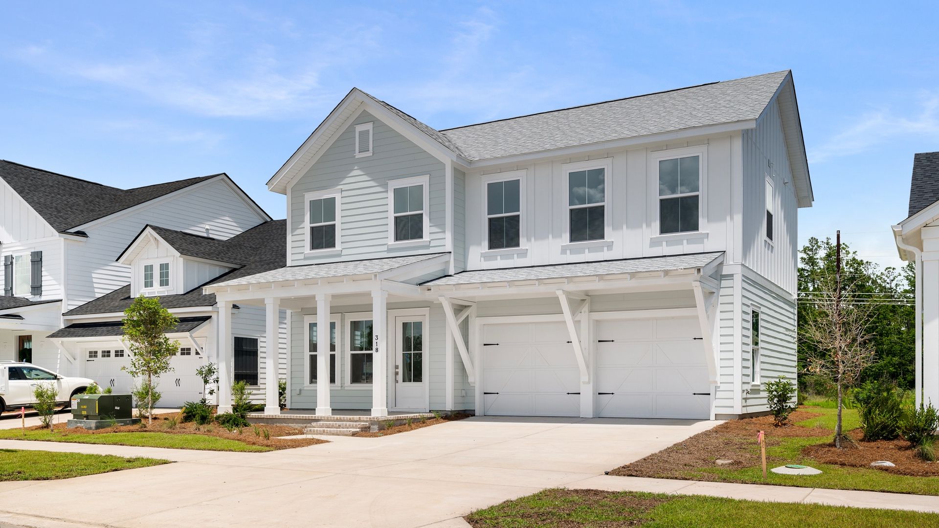 Exterior- Front:Two-story quick move-in home by DRB Homes in the Midtown at Nexton community in Summerville, SC with 2-car garage