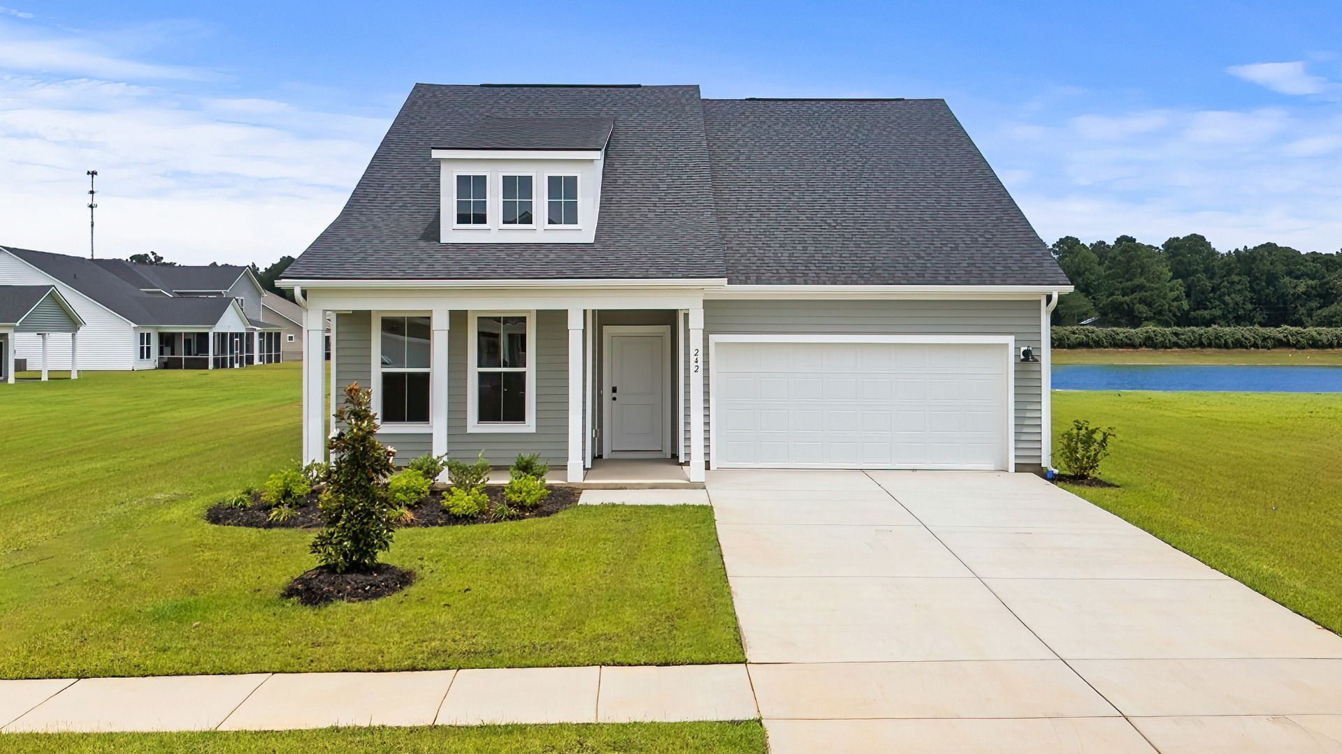 Chelsea- Elevation 4:Chelsea Elevation 4 at Chestnut Farms in Longs, SC with front porch and upper-level window detail