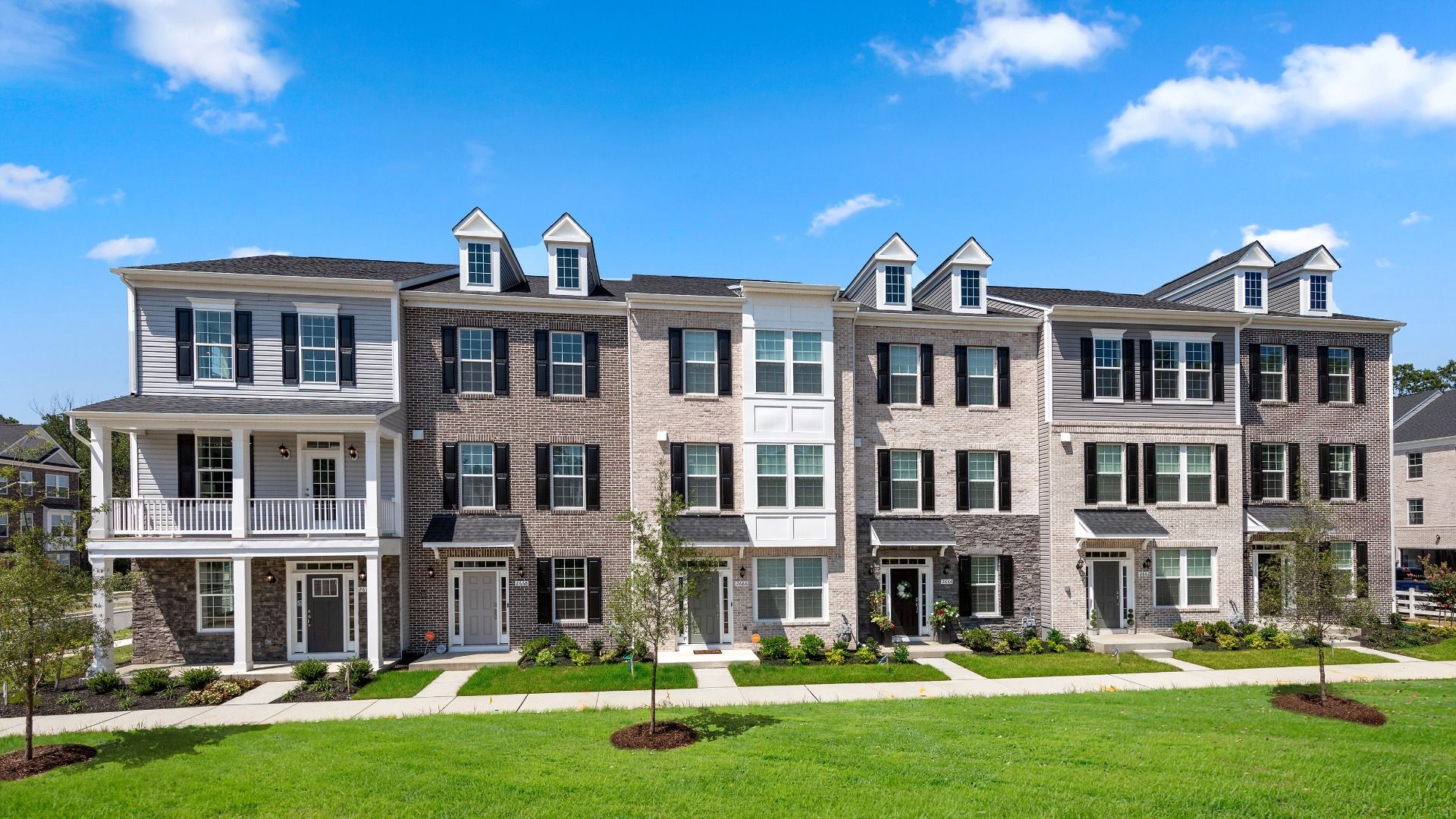 Exterior townhome Building:Townhome Exterior 1and 2 car garage rear load garage