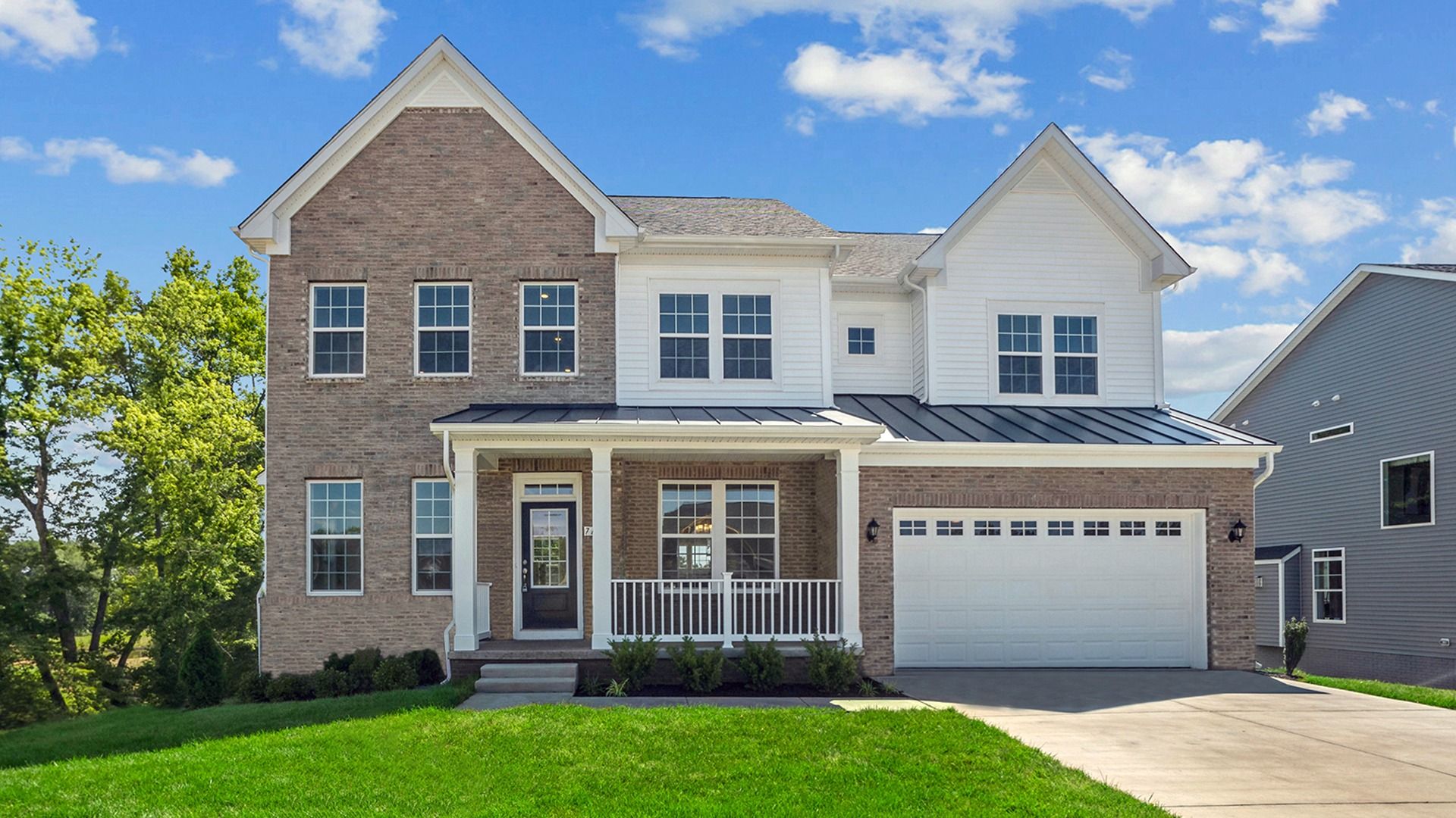 Emory Exterior:The Emory Design with Brick and Siding at Fairway Estates