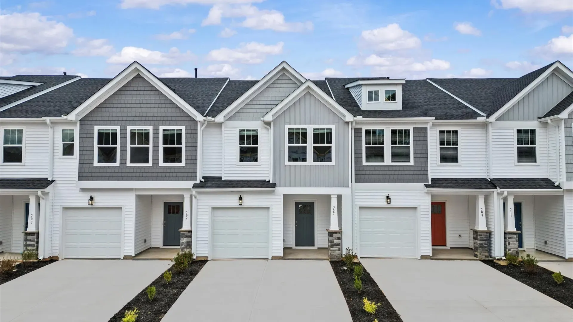 Notable street presence with tasteful elevation and thoughtful landscaping:Superior craftsmanship throughout this established townhome community near vibrant Downtown Greenville