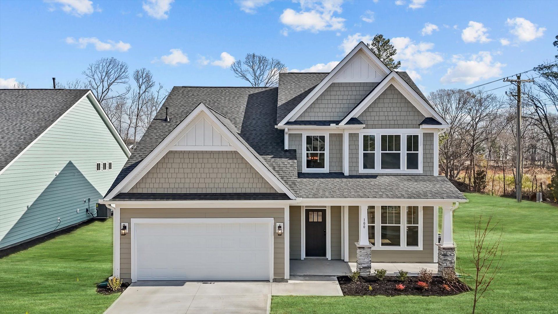 Exceptional home with tasteful exterior finishes and a thoughtfully designed façade:First-rate curb appeal with clean lines and a welcoming front entry