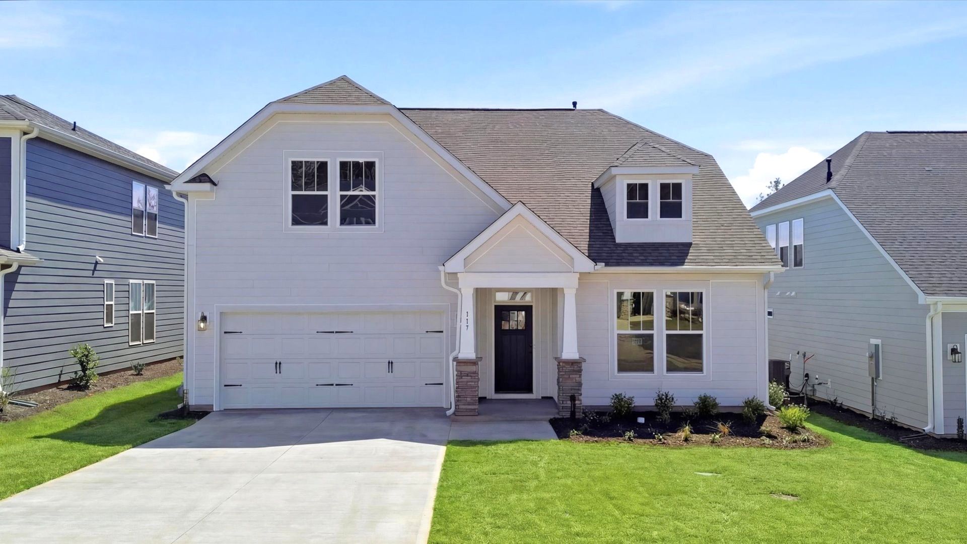 Elevated curb appeal with timeless stone accents and a welcoming covered entry:Desirable location and established charm in this superior two-story single family home community near Downtown Fountain Inn
