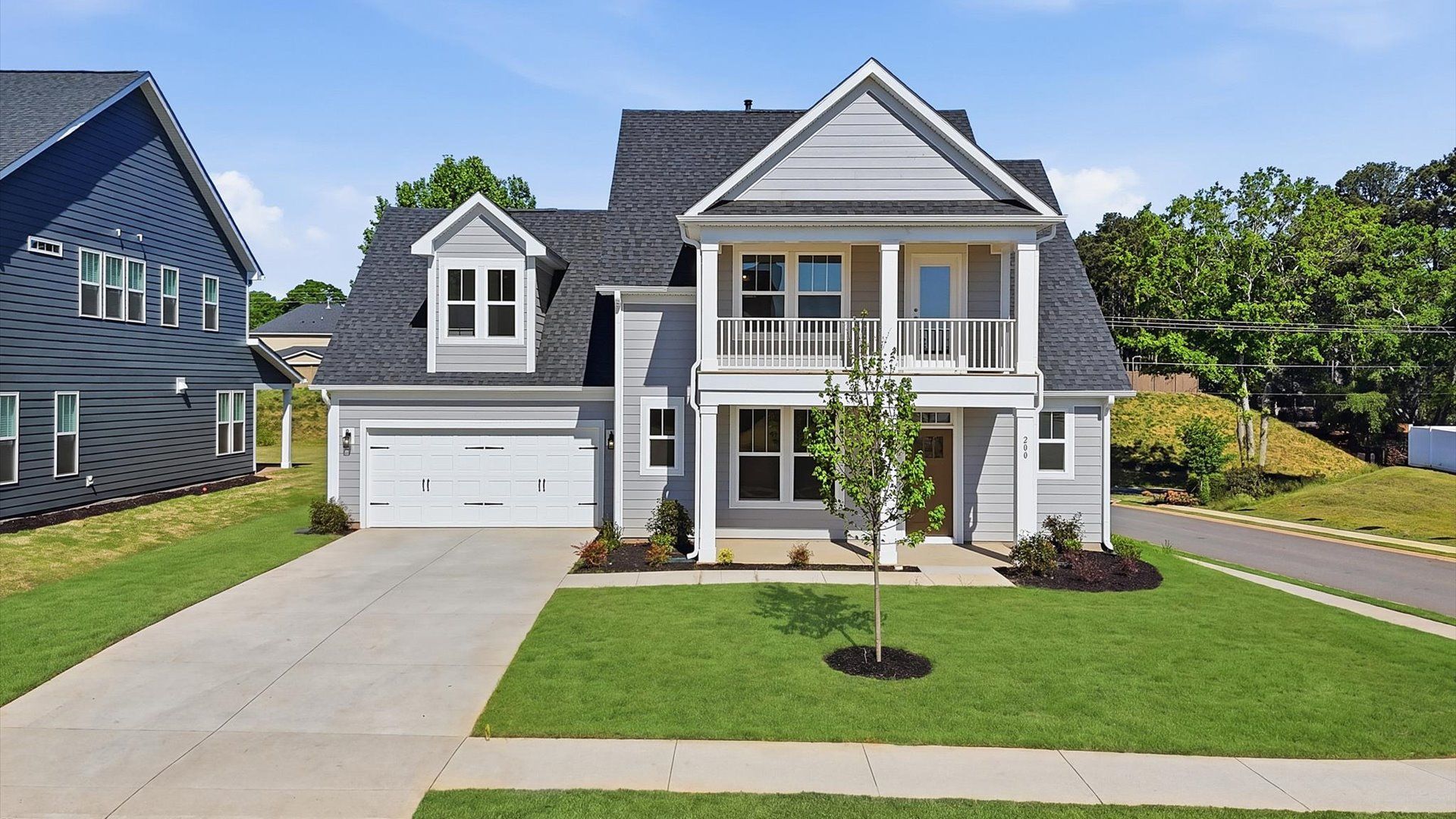 Notable street presence with tasteful elevation and thoughtful landscaping:First-rate curb appeal with clean lines and a welcoming front entry