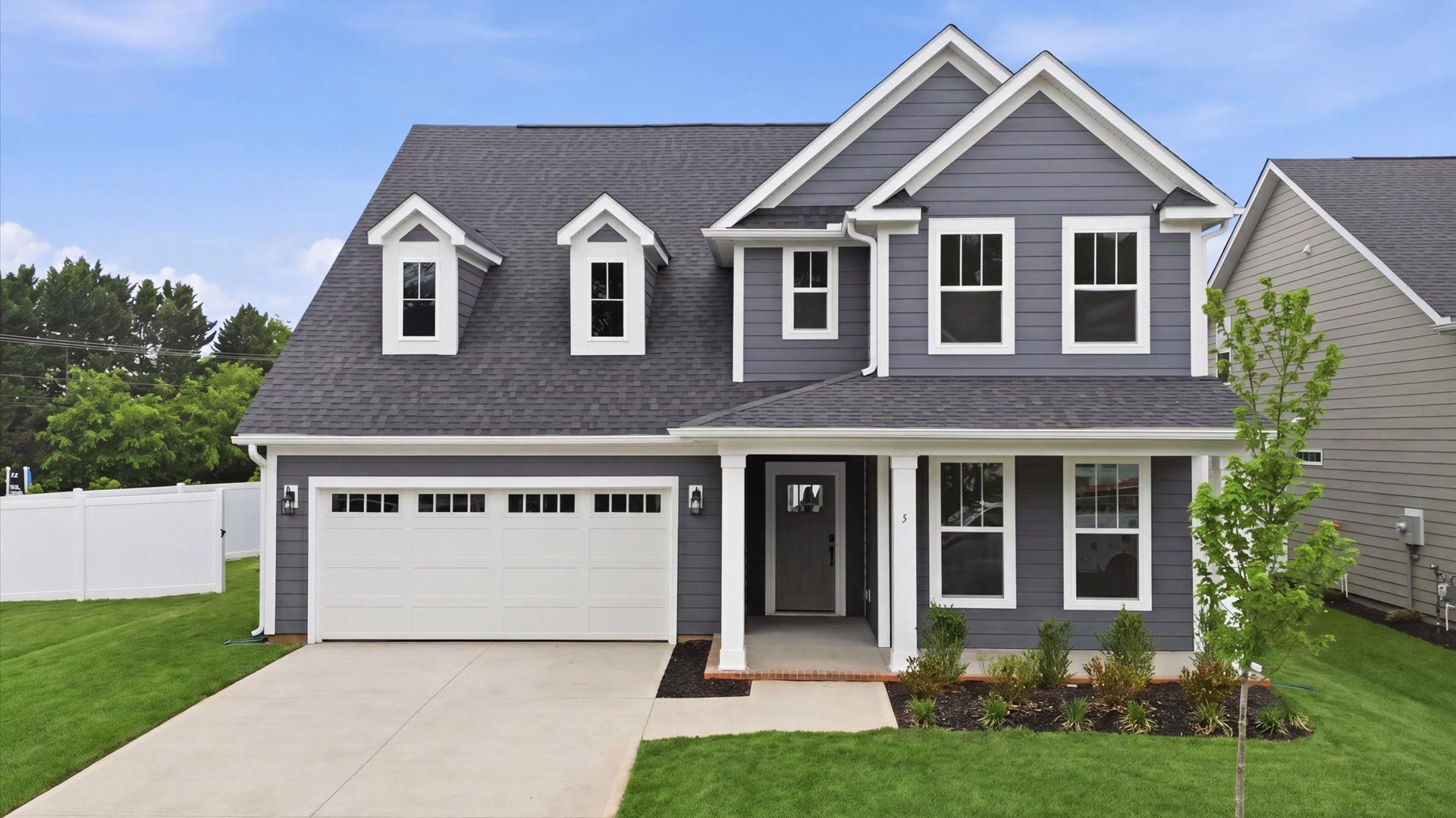 Classic-meets-modern exterior with clean rooflines and thoughtful craftsmanship:Functional design and eye-catching details in this accomplished single family home at Pelham Crossing