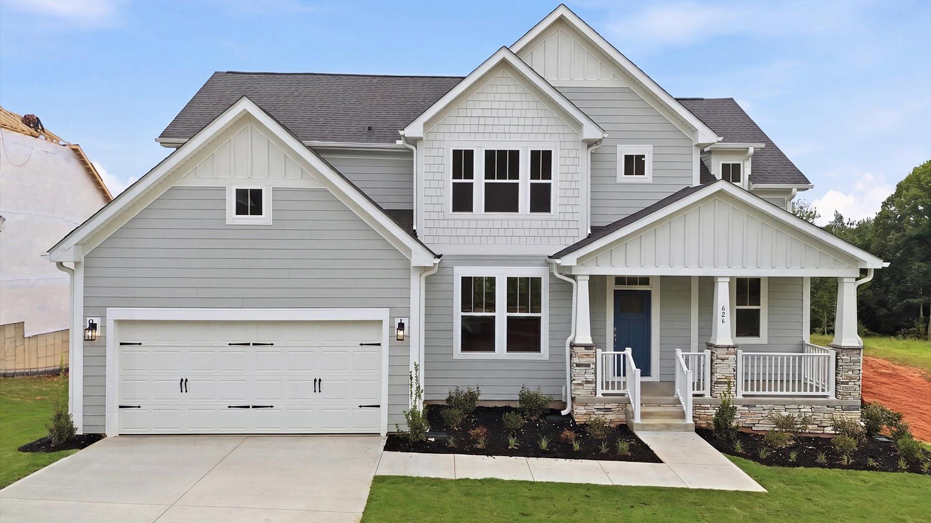 Elegant streetscape appeal in this thoughtfully constructed DRB home:Memorable first impression with elegant exterior design and exceptional materials at the Pinebrook community