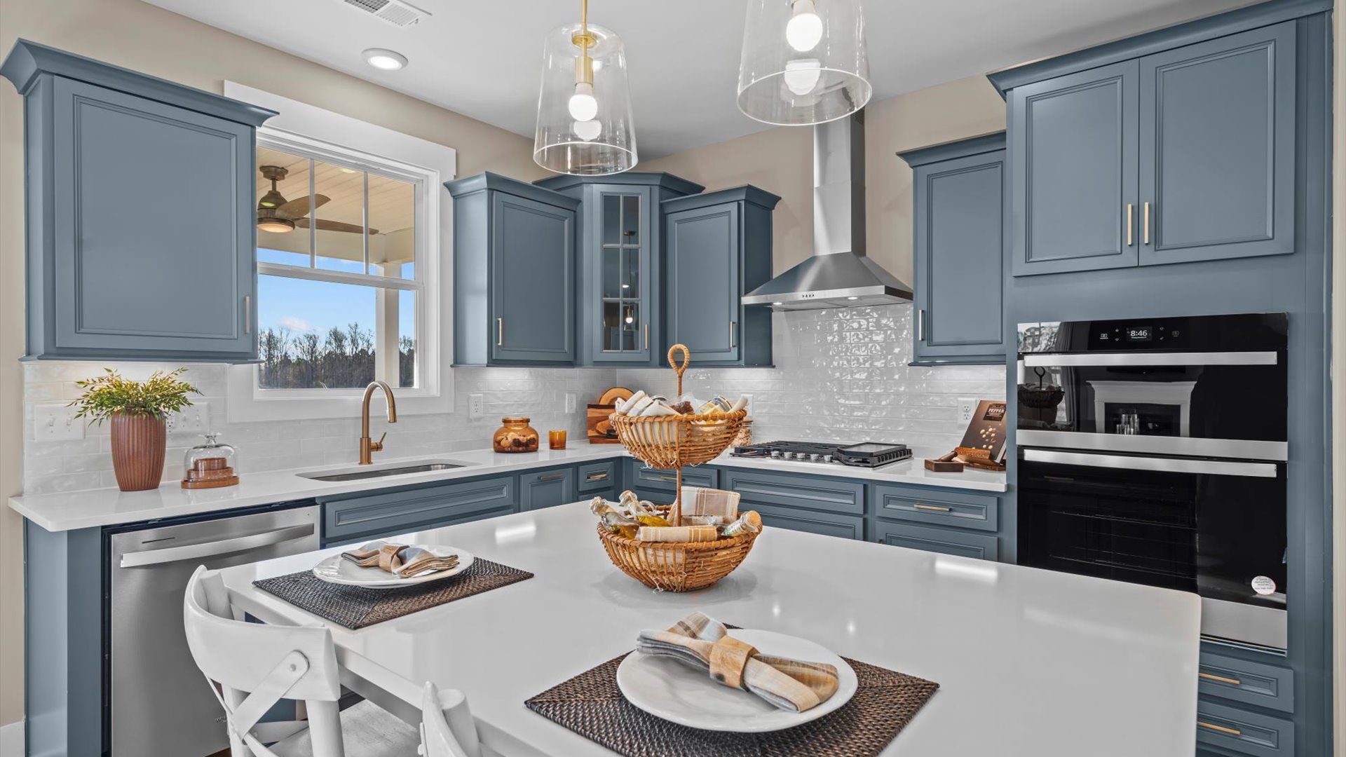 Kitchen in two story home at Mulberry Estates by DRB Homes in Simpsonville, South Carolina:Stunning blue cabinetry kitchen at Mulberry Estates by DRB Homes in Simpsonville, South Carolina