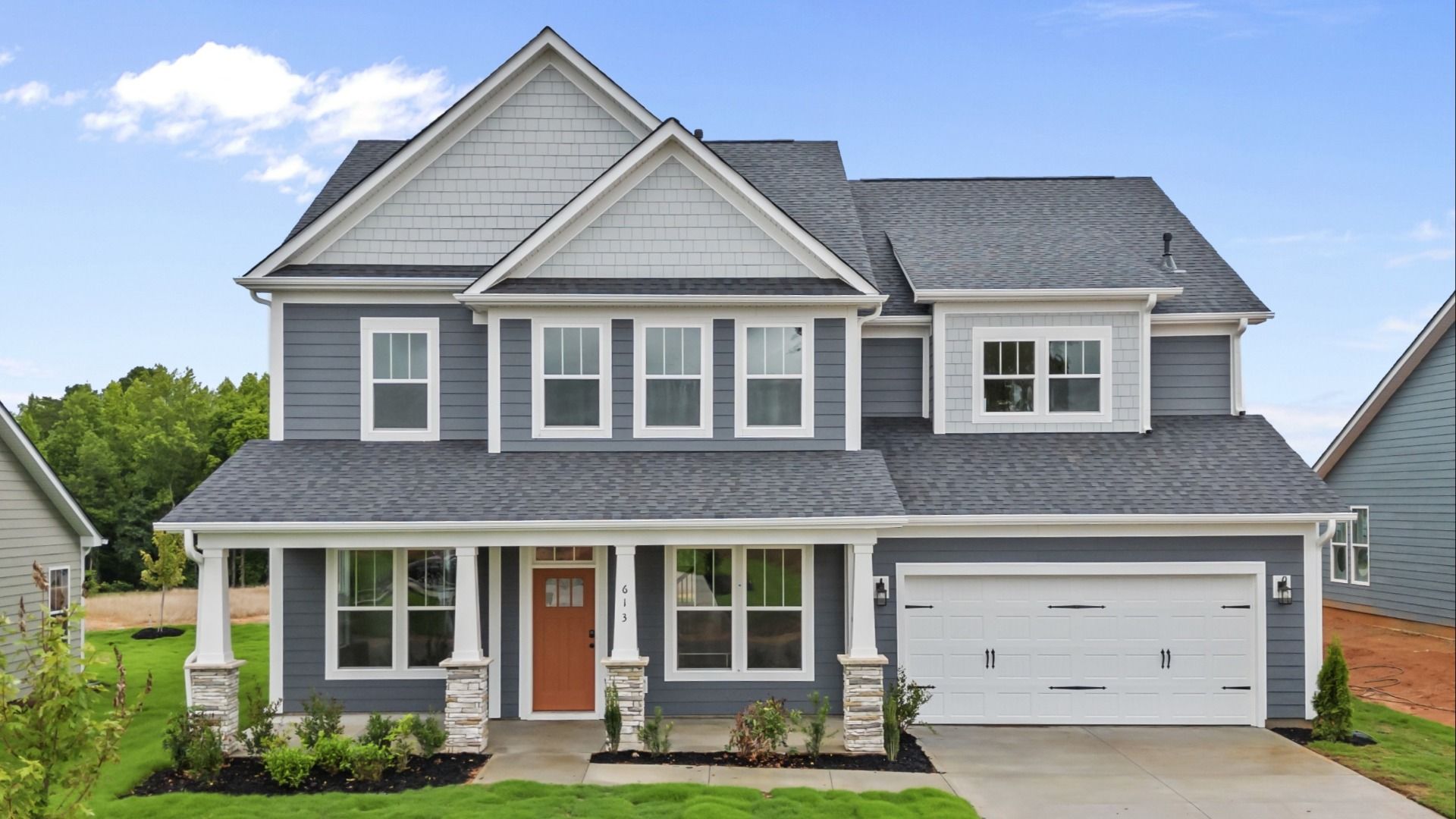 Craftsman style home with luxury exterior and up to 6 bedrooms at Kayfield at Midway in Anderson, SC:Craftsman exterior at Kayfield at Midway by DRB Homes with dark james hardie colorplus siding in Anderson, SC by DRB Homes
