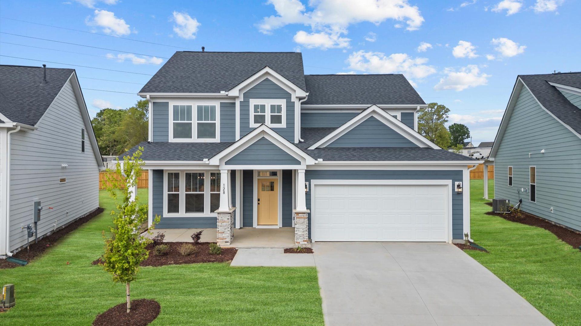 Exterior of two story home at Mulberry Estates by DRB Homes in Fountain Inn, SC:Stunning dark blue exterior two story home with two car garage at Mulberry Estates by DRB Homes in Fountain Inn, SC