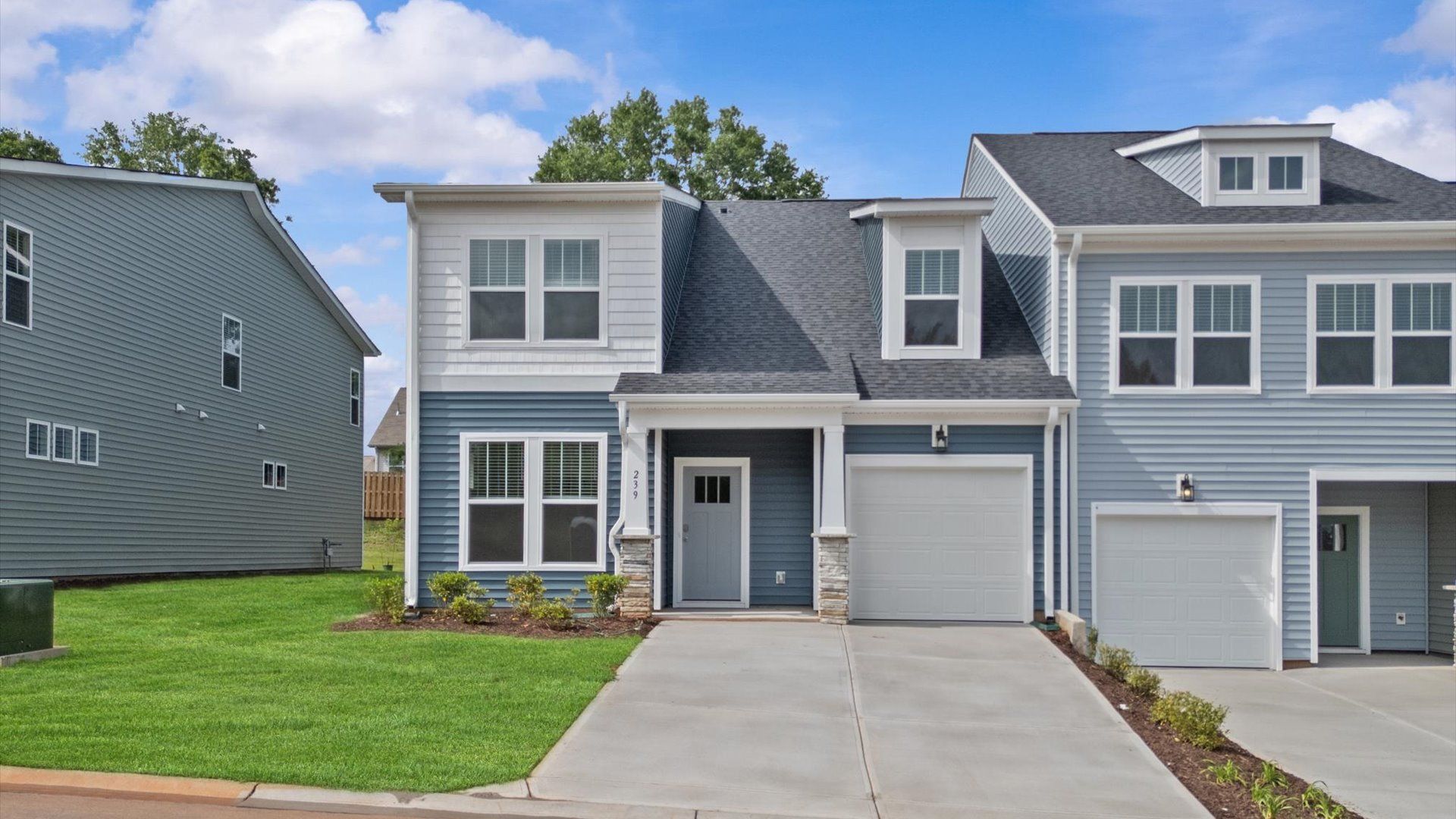 Exterior of two story townhome at Aspen Ridge by DRB Homes in Lyman, SC