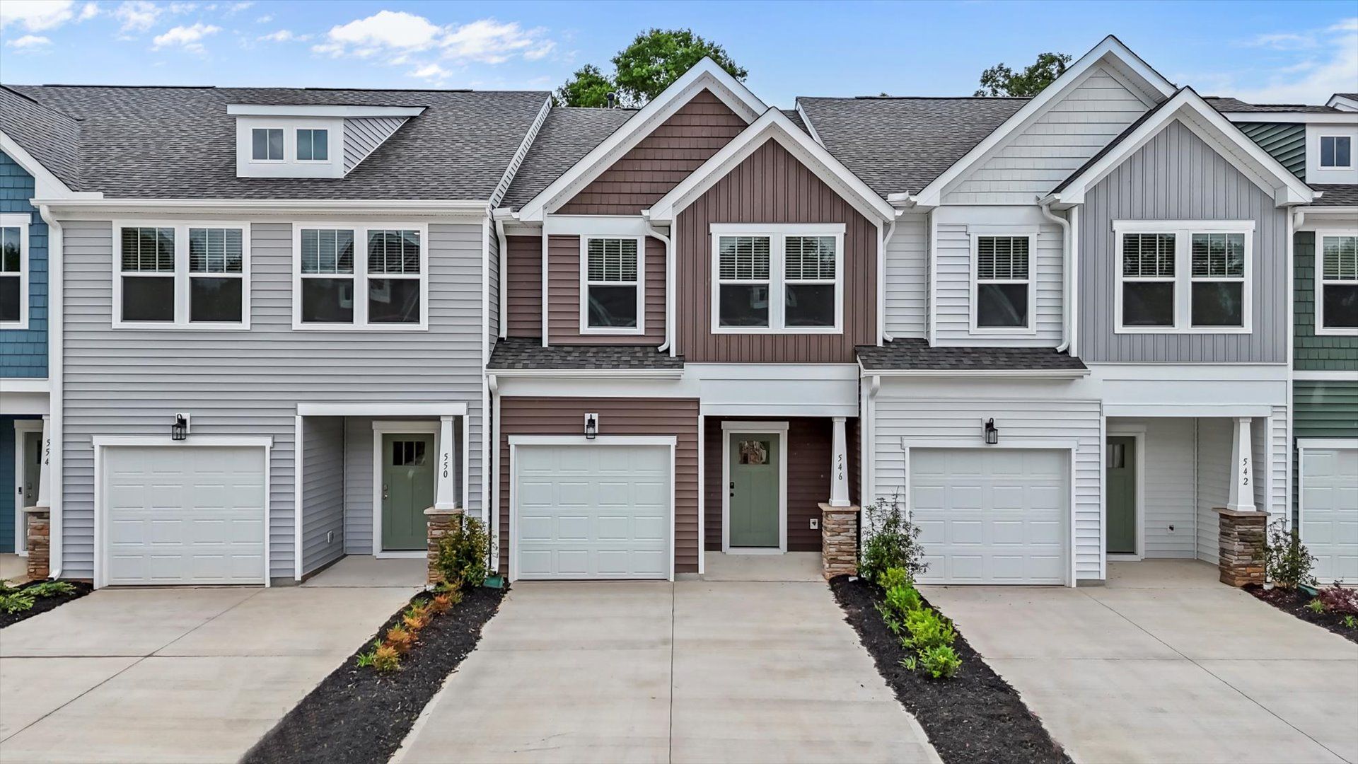 Exterior of two story townhome at Ransdell Pointe by DRB Homes in Spartanburg, SC:Two story townhome with two car driveway at Ransdell Pointe by DRB Homes in Spartanburg, SC