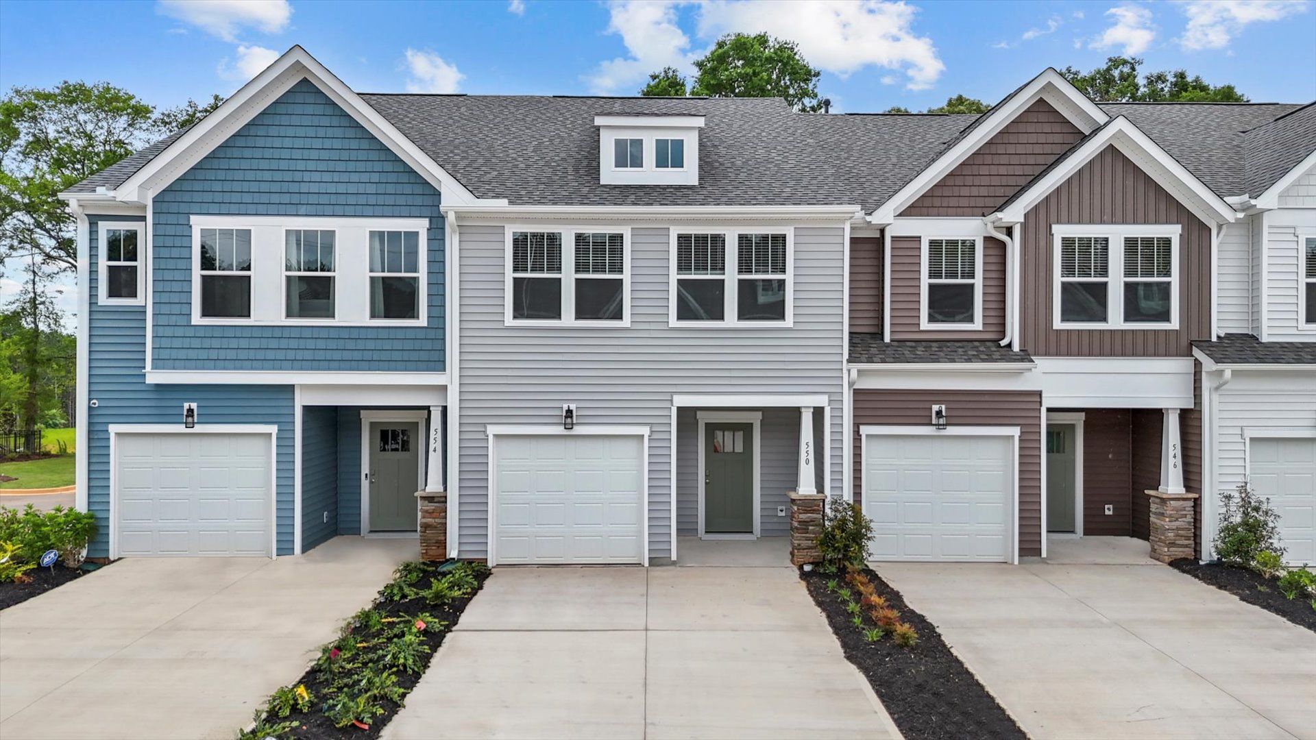 Exterior of two story townhome at Ransdell Pointe by DRB Homes in Spartanburg, SC:Two story townhome with large windows at Ransdell Pointe by DRB Homes in Spartanburg, SC
