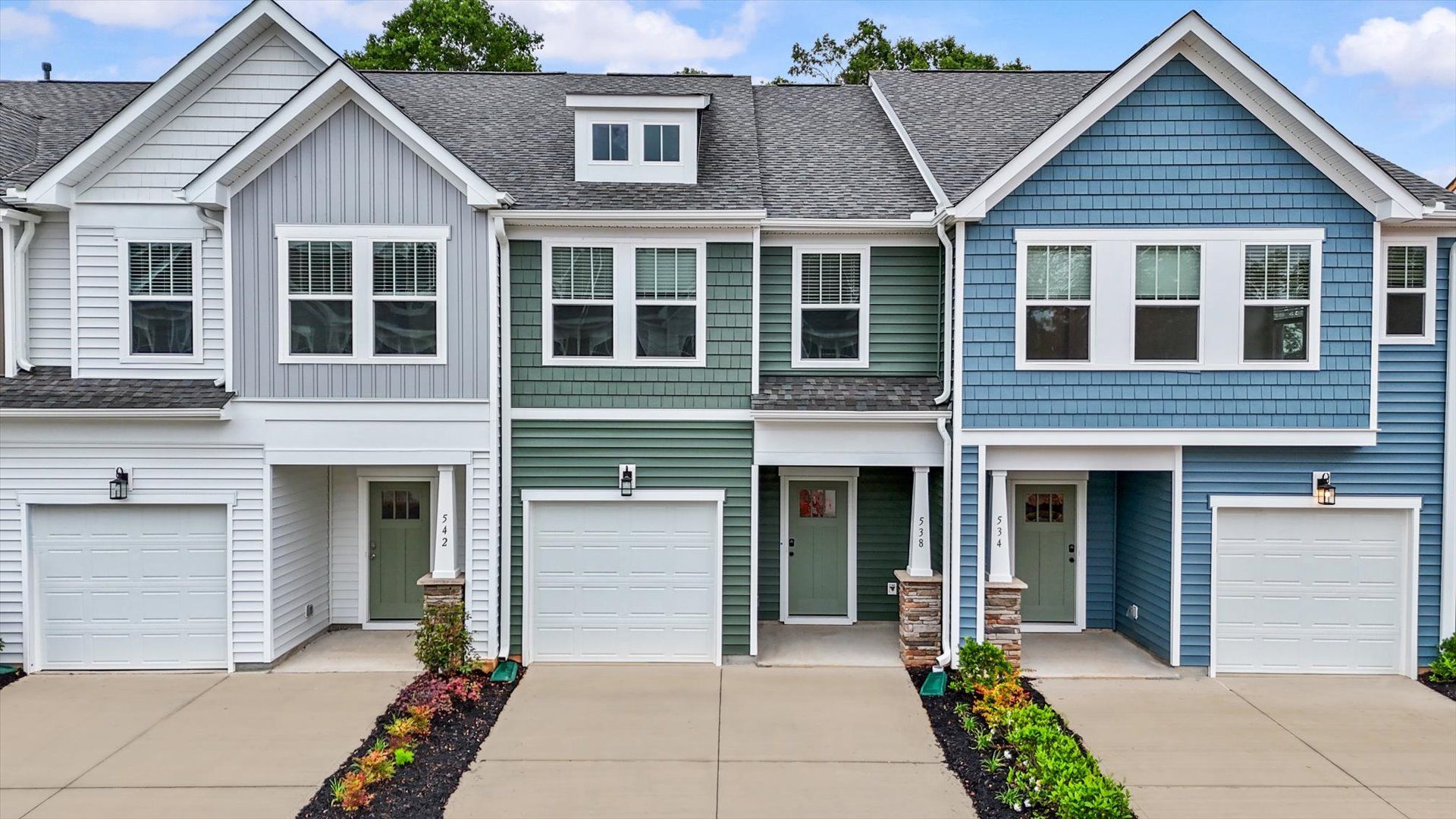 Exterior of two story townhome at Ransdell Pointe by DRB Homes in Spartanburg, SC:Green exterior two story townhome at Ransdell Pointe by DRB Homes in Spartanburg, SC