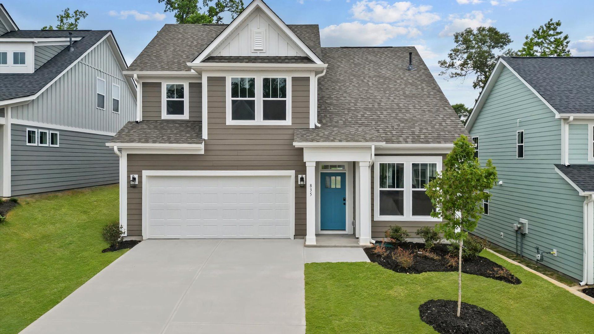 Exterior of two story home at Pleasant Falls by DRB Homes in Moore, SC:Two story home with large windows at Pleasant Falls by DRB Homes in Moore, SC
