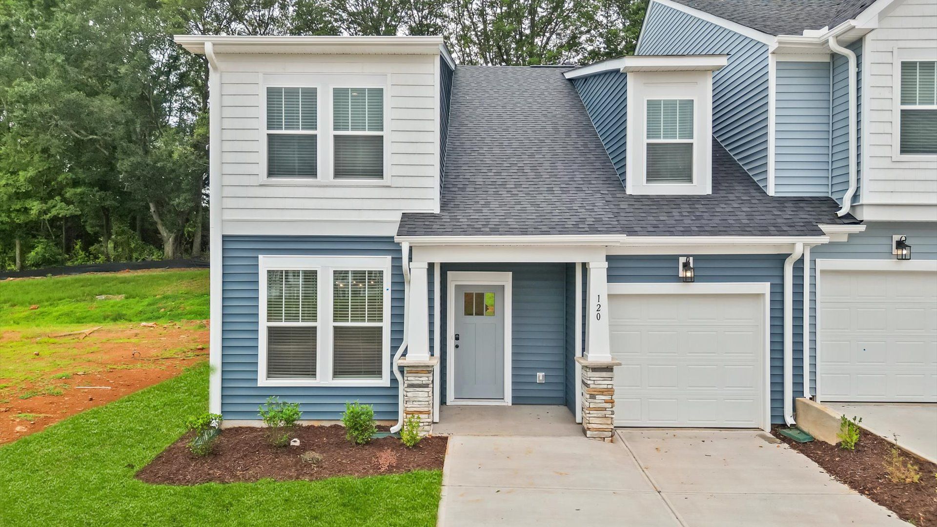 Functional design and eye-catching details in this accomplished townhome at Aspen Ridge:First-rate curb appeal with clean lines and a welcoming front entry