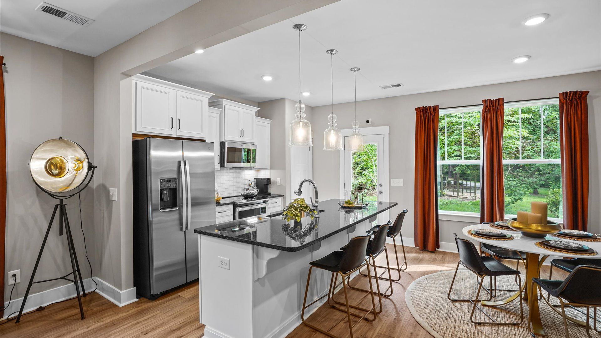 Beautiful kitchen with brown cabinets in Arden, NC at Clayton Crossing