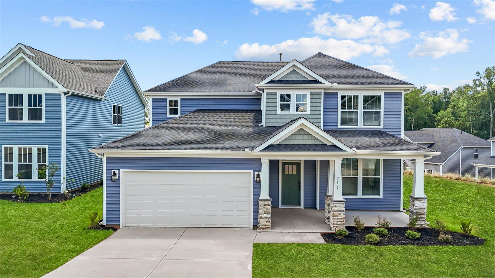 Exterior of two story home at Fox Hollow by DRB Homes in Spartanburg, SC:Highly skilled design meets functional luxury in this leading Spartanburg, SC home