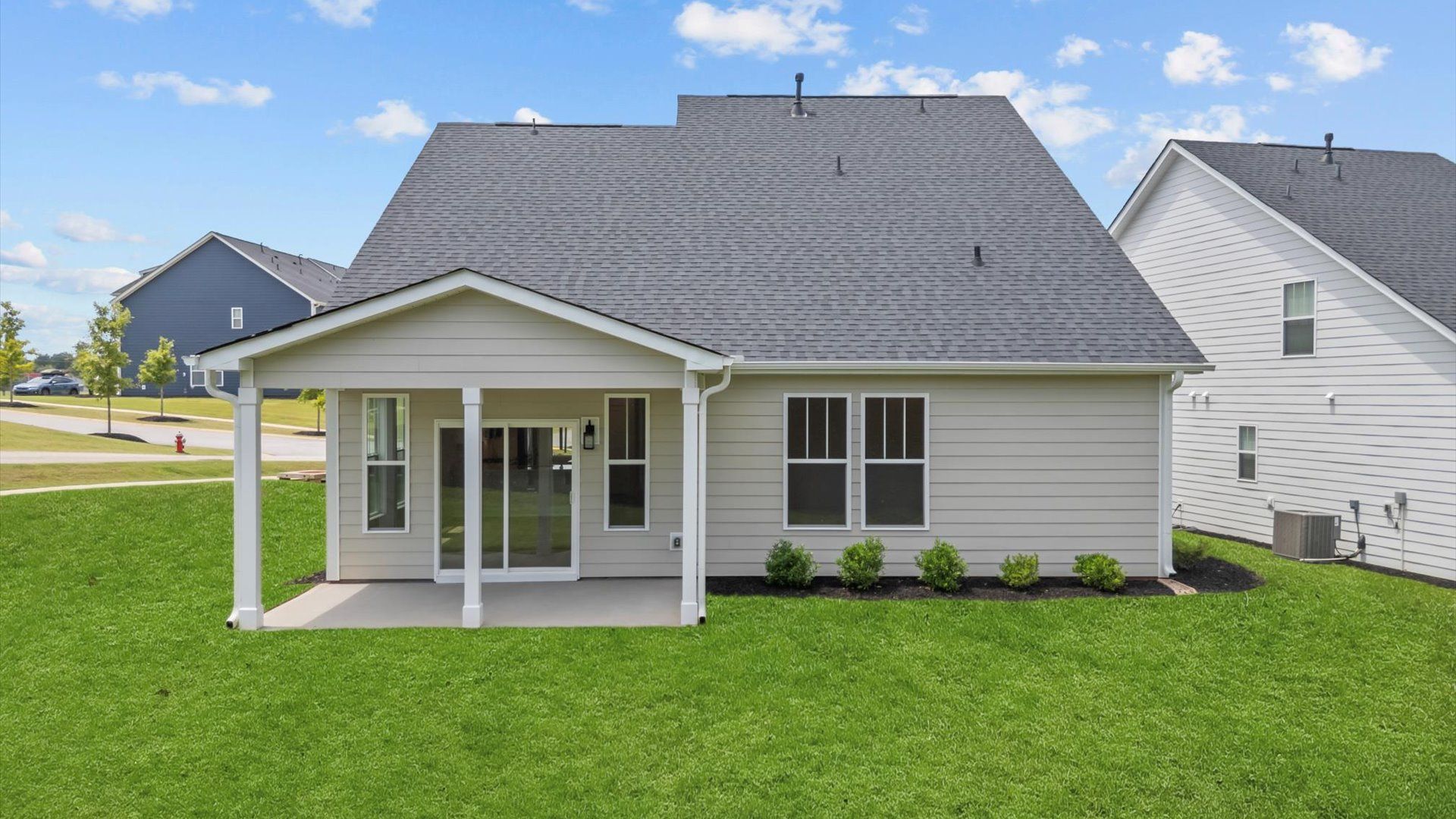 Exterior of two story home at Trailside at Drayton Mills by DRB Homes in Spartanburg, SC:Exceptional home with tasteful exterior finishes at Trailside at Drayton Mills by DRB Homes in Spartanburg, SC