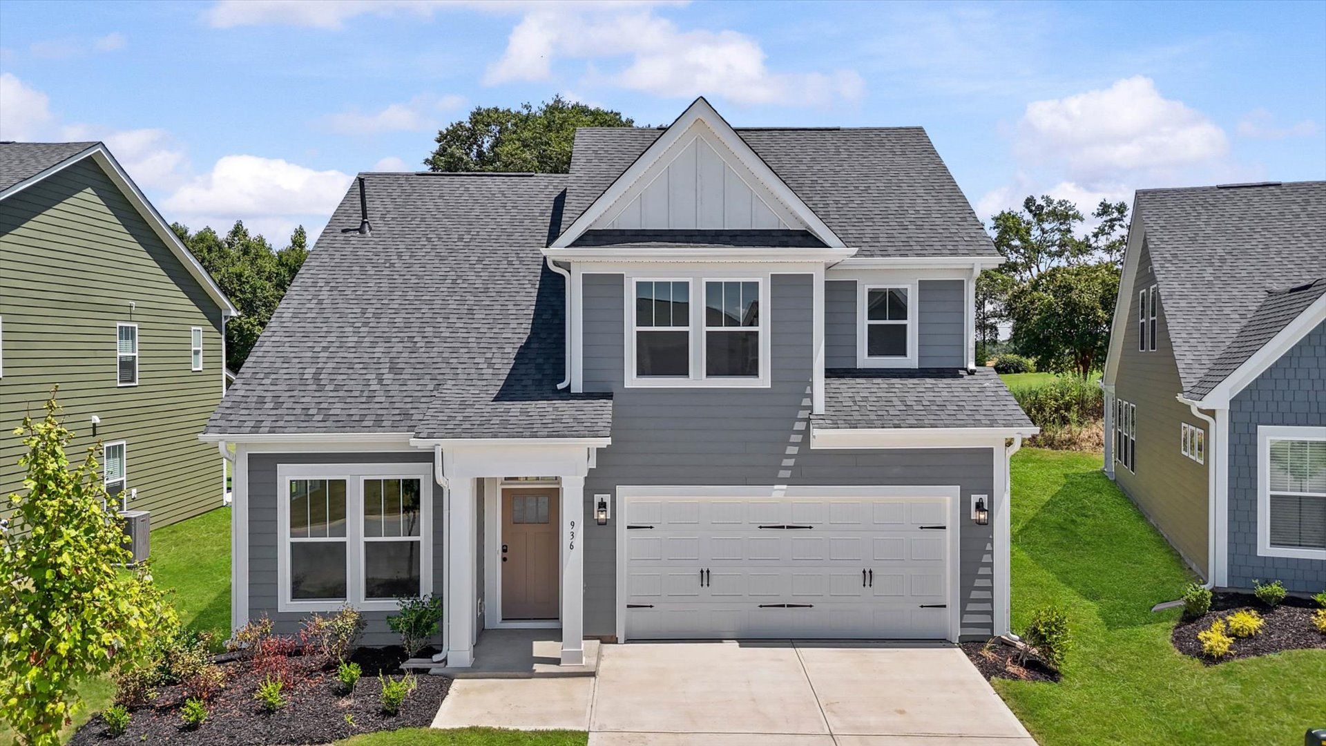 Exterior of two story home at Pleasant Falls by DRB Homes in Moore, SC:Proven curb appeal with elegant exterior lines and a warm, inviting presence at Pleasant Falls by DRB Homes in Moore, SC