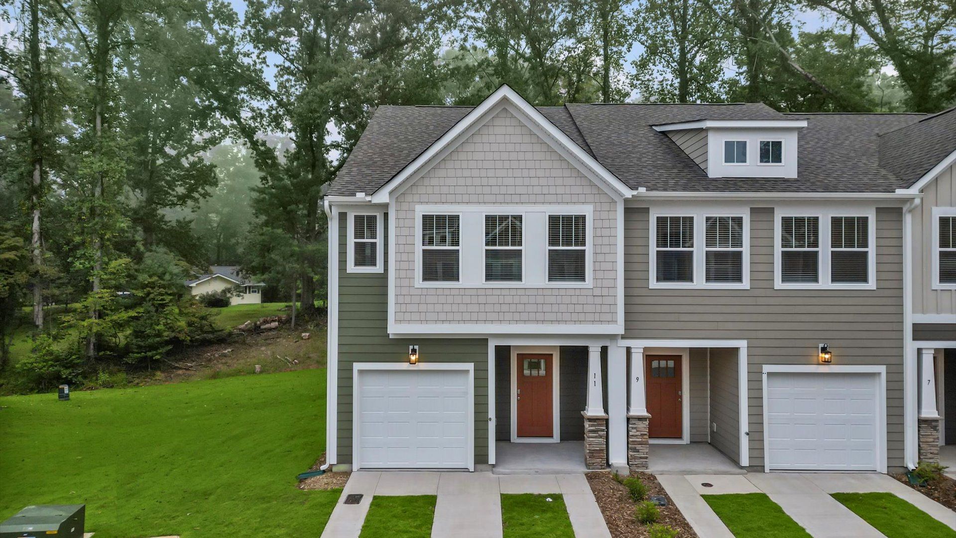 Exceptional home with tasteful exterior finishes and a thoughtfully designed façade:First-rate curb appeal with clean lines and a welcoming front entry