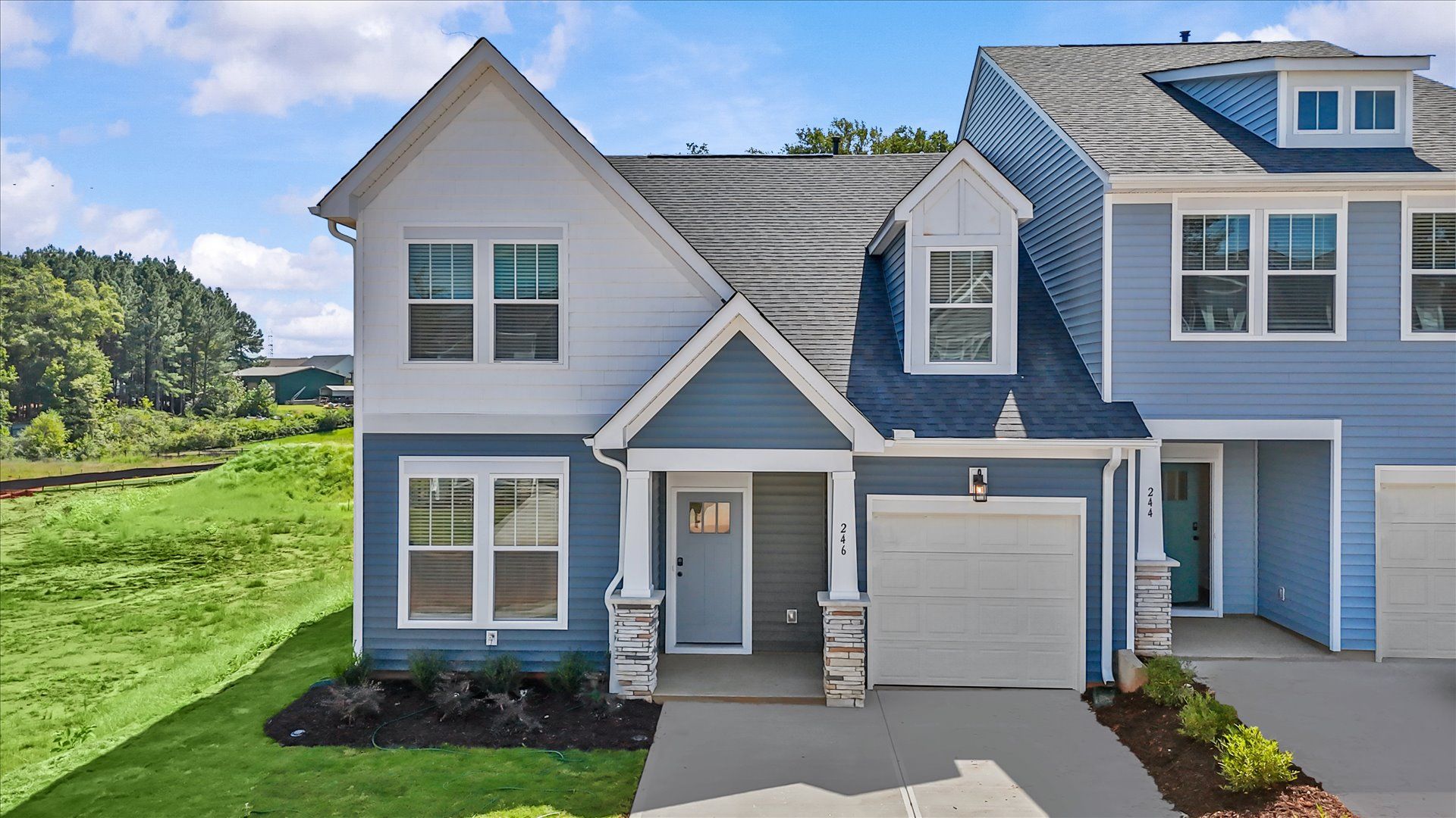 Tasteful open-concept layout in a prime two-story home by DRB Homes:Functional design and eye-catching details in this accomplished townhome at Aspen Ridge