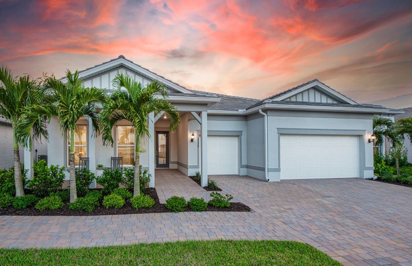Renown:Beautiful exterior of new construction home in Del Webb Naples, FL