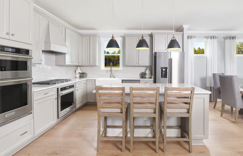 Exterior:The elegant pendant lighting complements the spacious gourmet Kitchen.