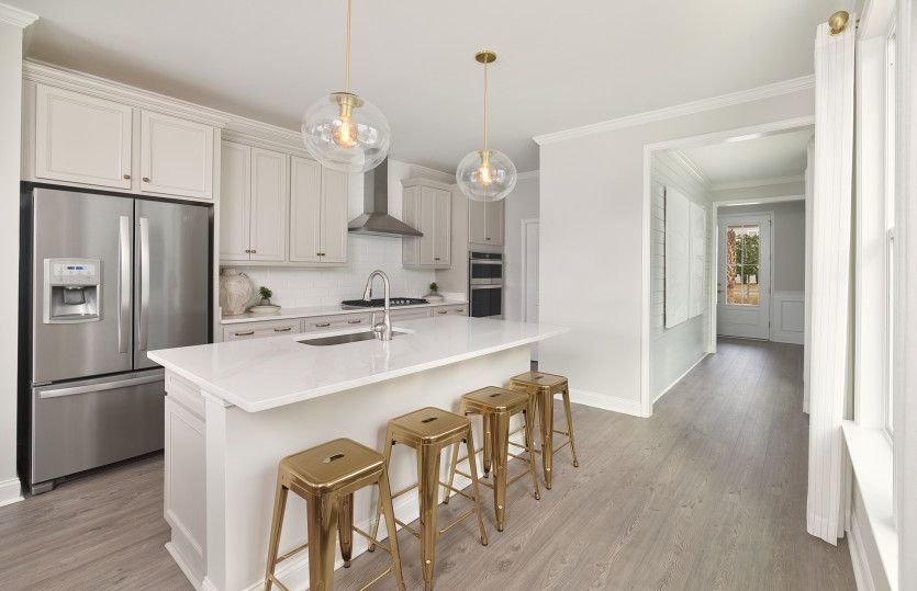 Exterior:Gourmet Kitchen area with beautiful white island and single bowl farm sink.