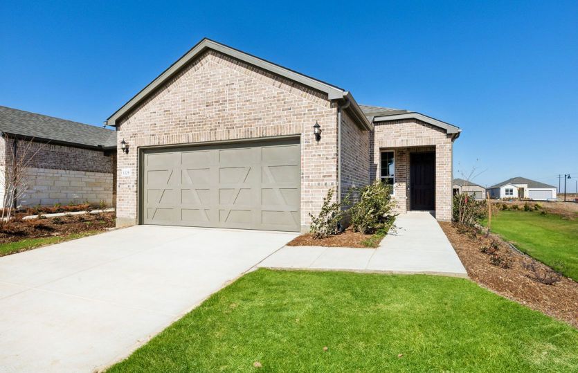 Exterior:The Compass, a one-story home with 2-car garage, shown with Home Exterior LS202