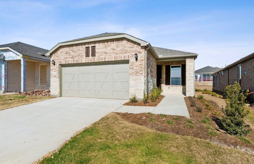 Exterior:The Contour, a one-story home with 2-car garage, shown with Home Exterior LS204
