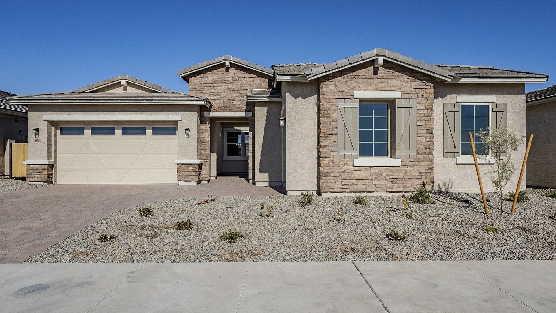 Modern Beige Home with Stone Facade in Benissa:Exquisite stone facade with elegant shuttered windows in Benissa. Embrace refined living with desert landscaping.