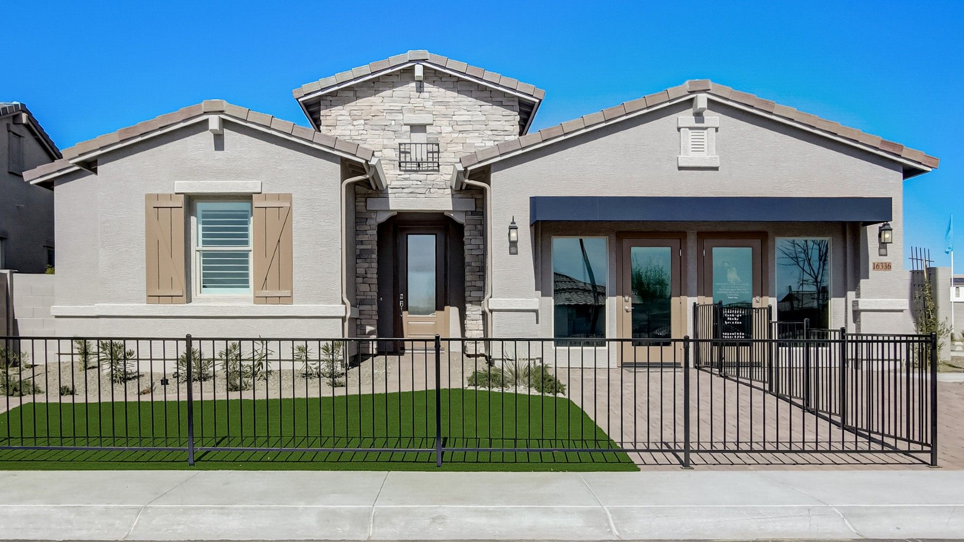 Modern Beige House at Mirada Crossing, Arizona:Elegant stone facade, dual entrance design, and pristine landscaping define this stunning Mirada Crossing residence.
