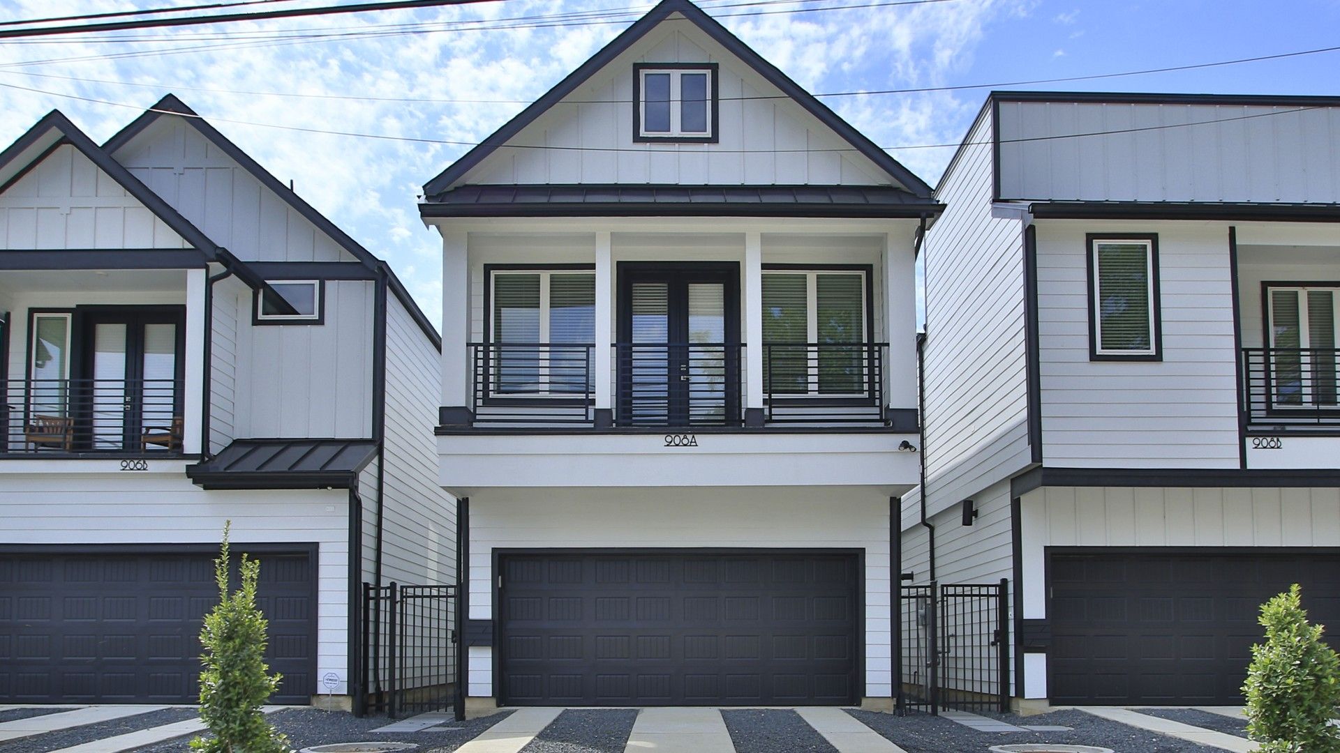 Modern Three-Story Detached Townhome in Shady Acres with Balcony and Garage:Luxurious Shady Acres deatched townhome featuring expansive balcony, and sleek geometric design.