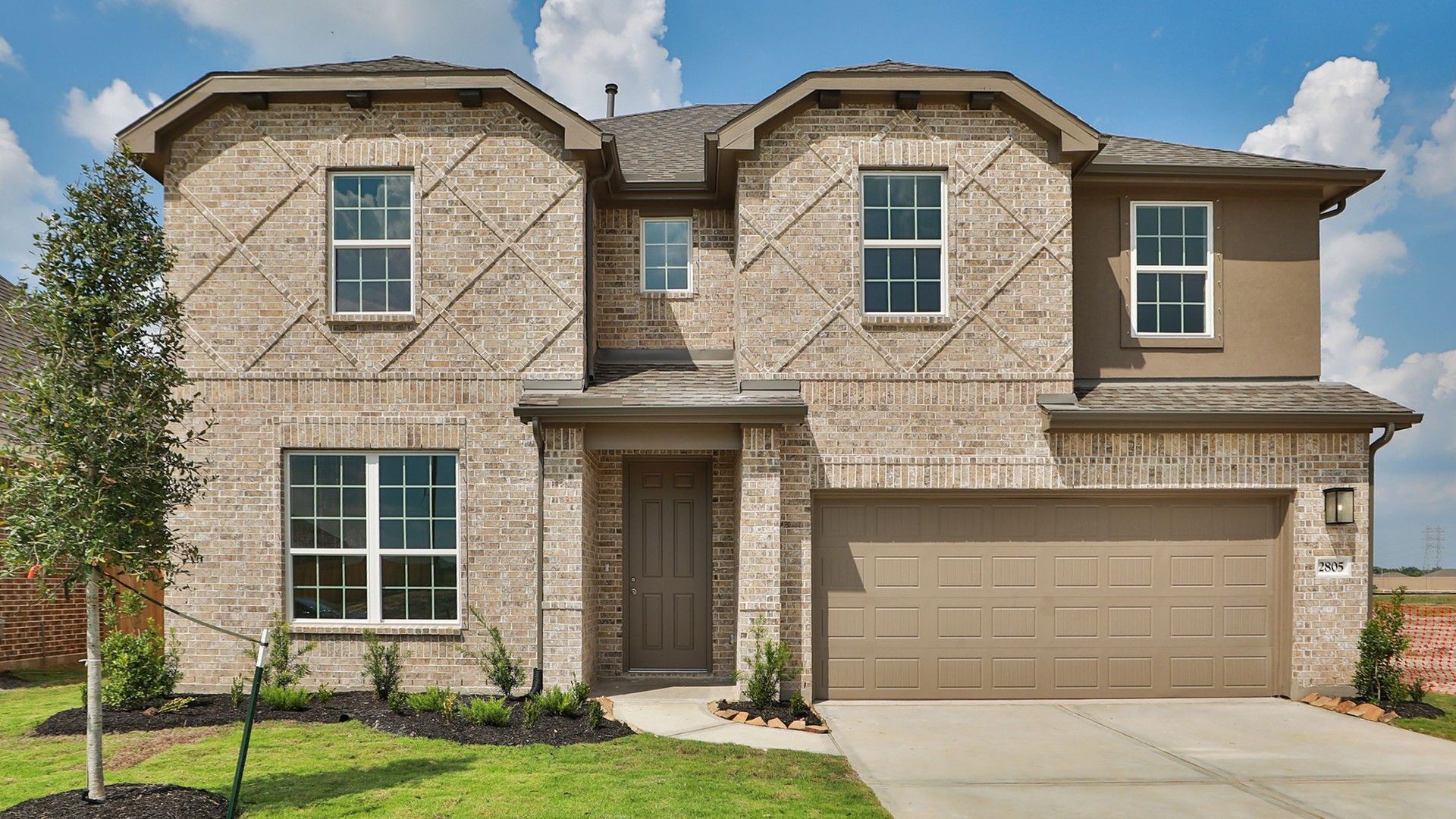 Modern Brick Home with Garage in Creekhaven:Elegant brick facade and expansive windows define this Creekhaven estate, blending luxury with natural beauty.