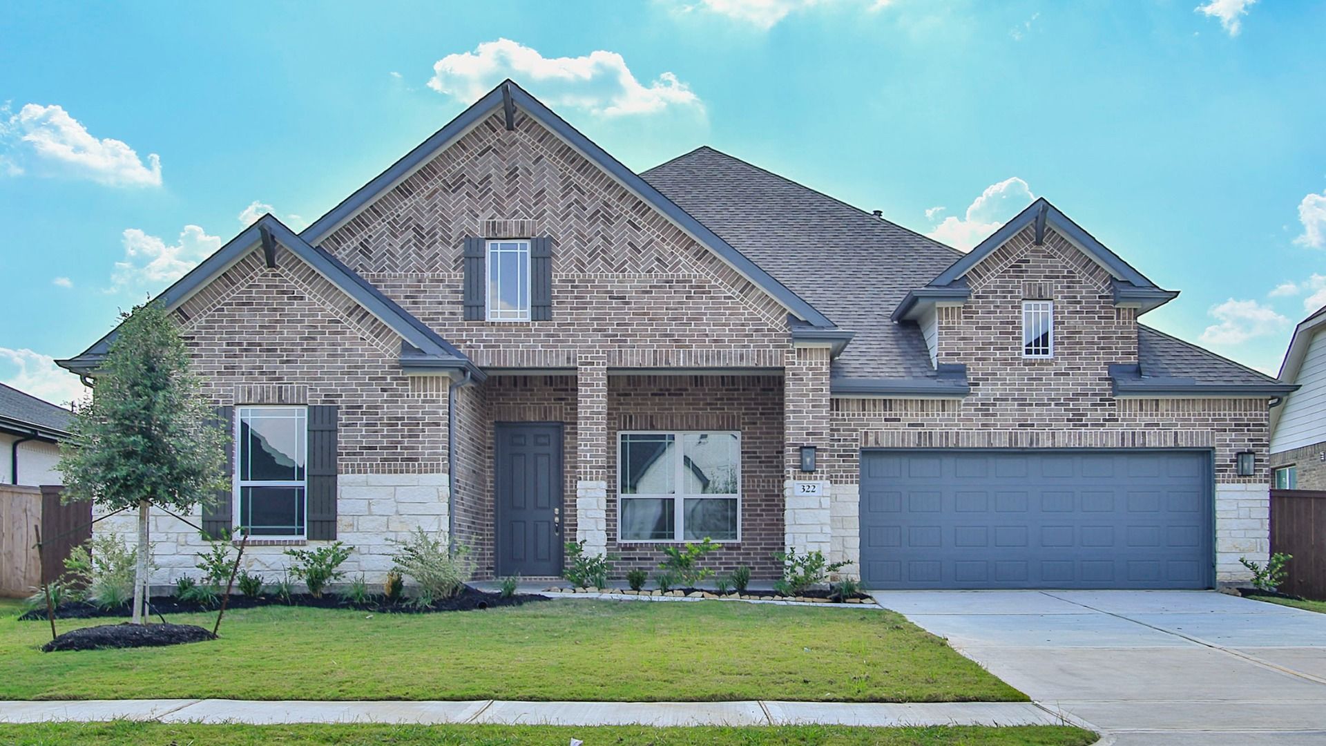 Elegant Brick and Stone Bungalow in Brookewater:Stunning brick facade with intricate stone detailing enhances this Brookewater residence's timeless elegance.